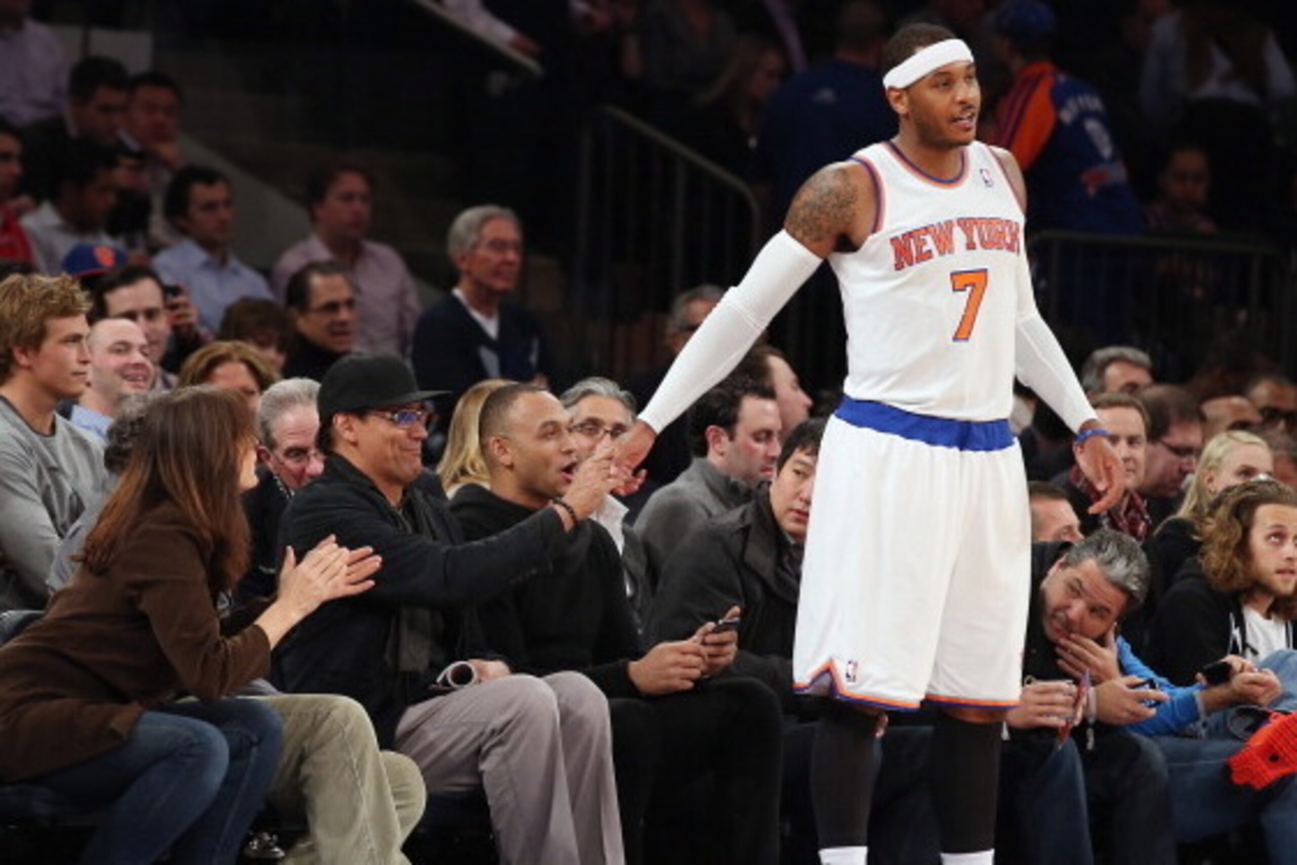 NEW YORK, NY - DECEMBER 11: Carmelo Anthony #7 of the New York Knicks shakes hands with actor Jimmy Smits at the start of the game against the Chicago Bulls at Madison Square Garden on December 11, 2013 in New York City. The Knicks defeated the Bulls 83-7