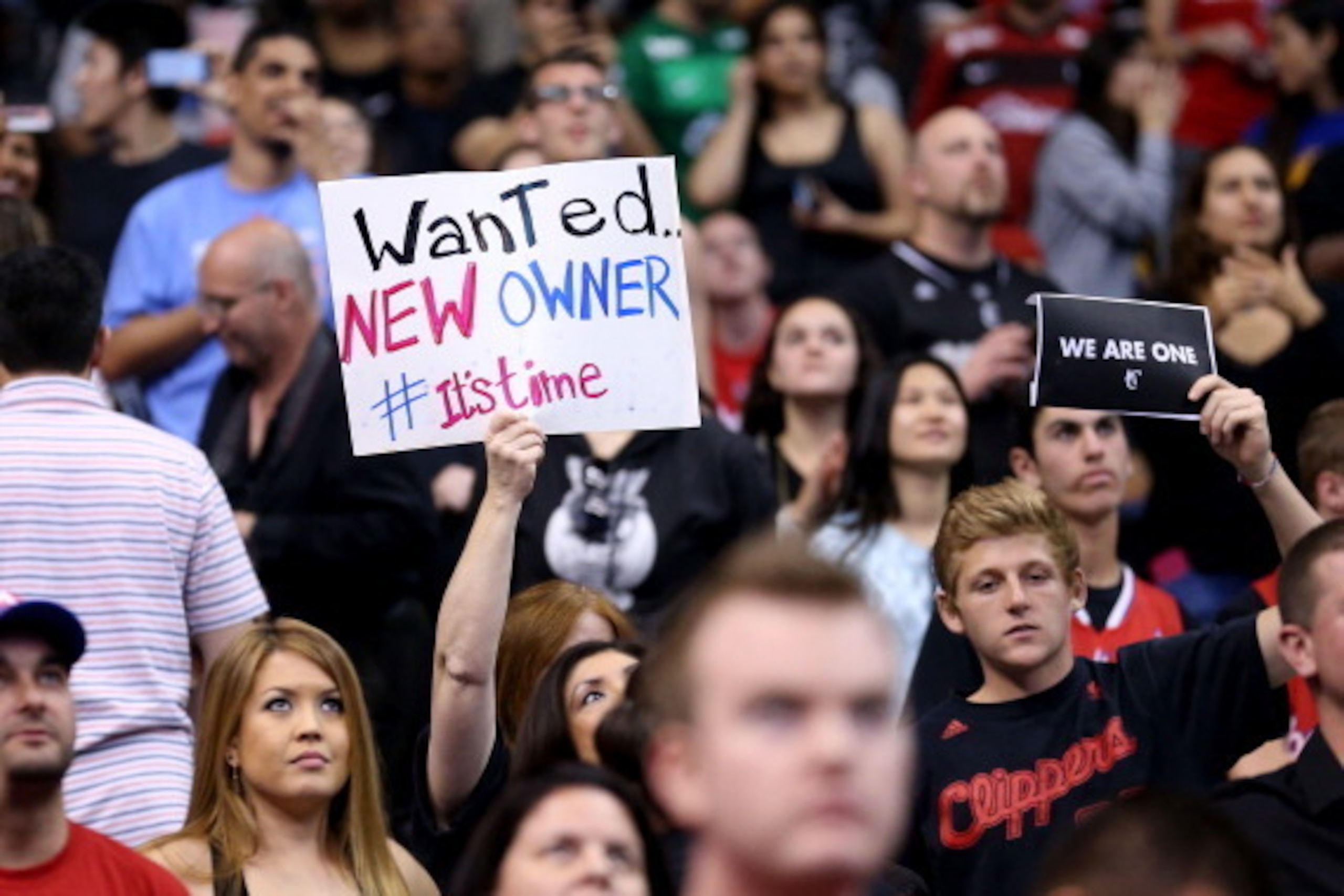 LOS ANGELES, CA - APRIL 29:  Los Angeles Clippers hold up signs referencing the Donald Sterling situation before the game with the Golden State Warriors in Game Five of the Western Conference Quarterfinals during the 2014 NBA Playoffs at Staples Center on