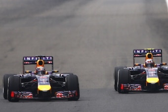 SHANGHAI, CHINA - APRIL 20:  Sebastian Vettel of Germany and Infiniti Red Bull Racing and Daniel Ricciardo of Australia and Infiniti Red Bull Racing compete during the Chinese Formula One Grand Prix at the Shanghai International Circuit on April 20, 2014 