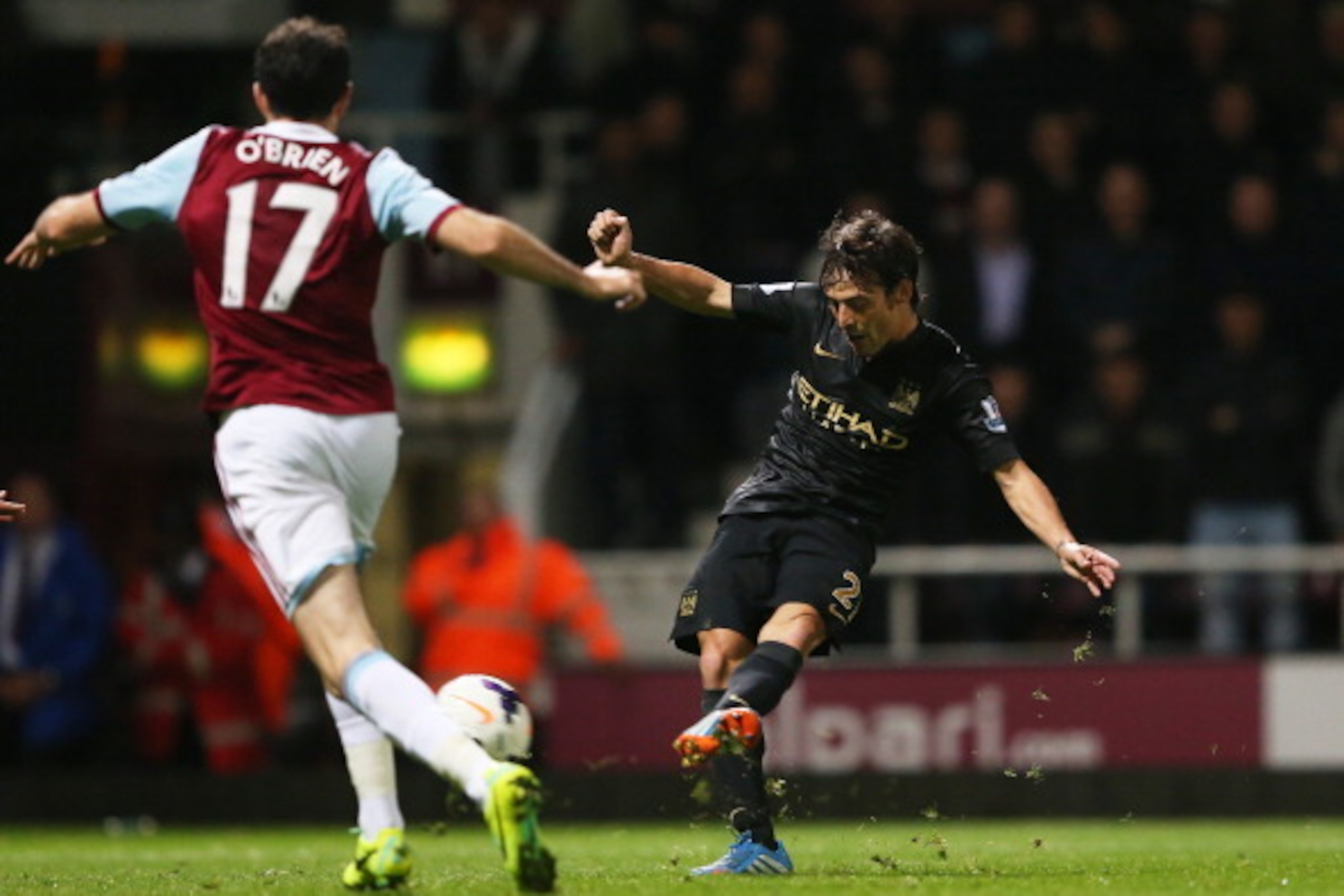 LONDON, ENGLAND - OCTOBER 19:  David Silva of Manchester City scores his team's third goal during the Barclays Premier League match between West Ham United and Manchester City at Boleyn Ground on October 19, 2013 in London, England.  (Photo by Warren Litt