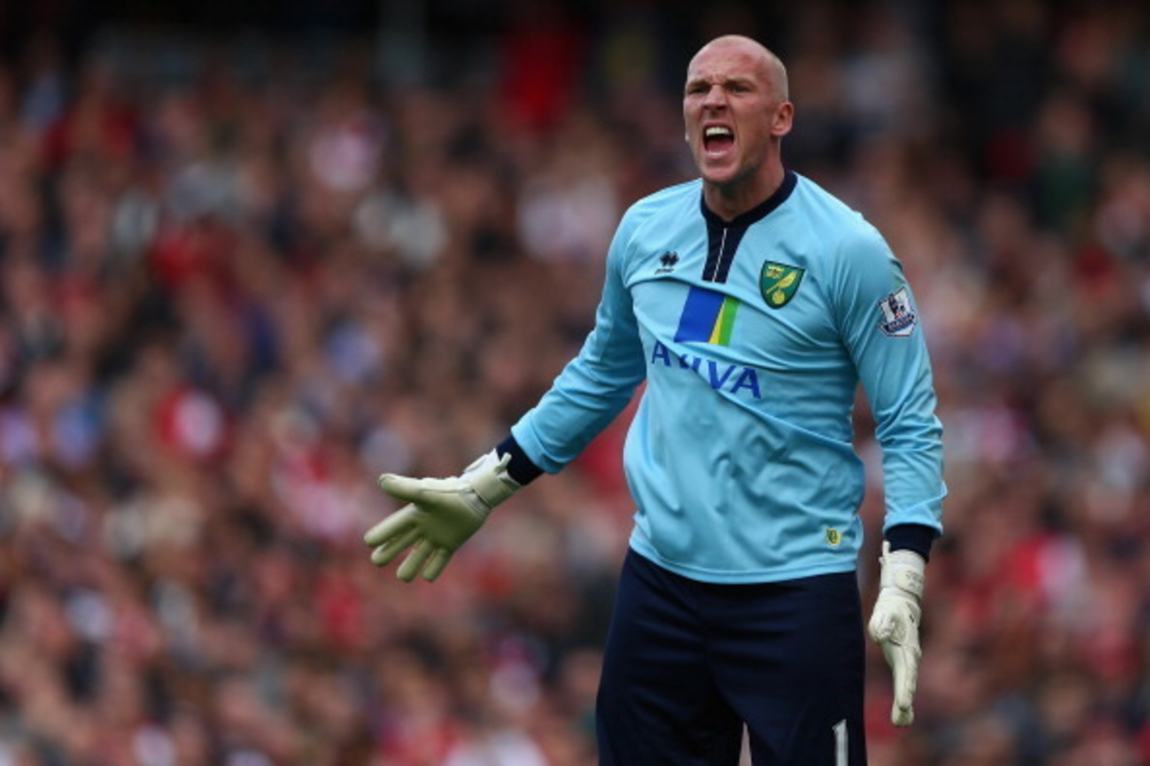 LONDON, ENGLAND - OCTOBER 19:  John Ruddy of Norwich City in action during the Barclays Premier League match between Arsenal and Norwich City at the Emirates Stadium on October 19, 2013 in London, England.  (Photo by Paul Gilham/Getty Images)