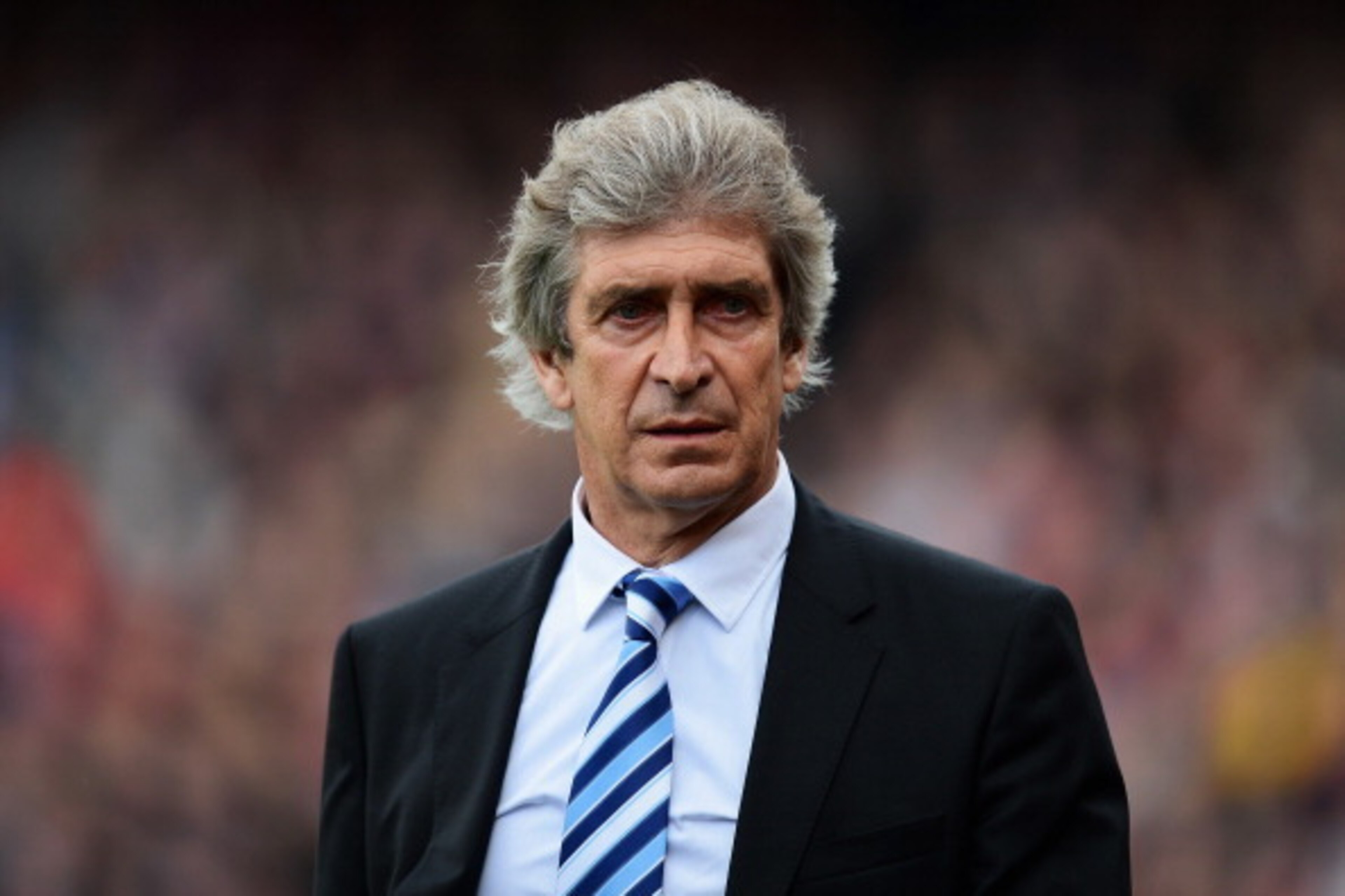 LONDON, ENGLAND - APRIL 27:  Manuel Pellegrini, manager of Manchester City walks out for the Barclays Premier League match between Crystal Palace and Manchester City at Selhurst Park on April 27, 2014 in London, England.  (Photo by Jamie McDonald/Getty Im