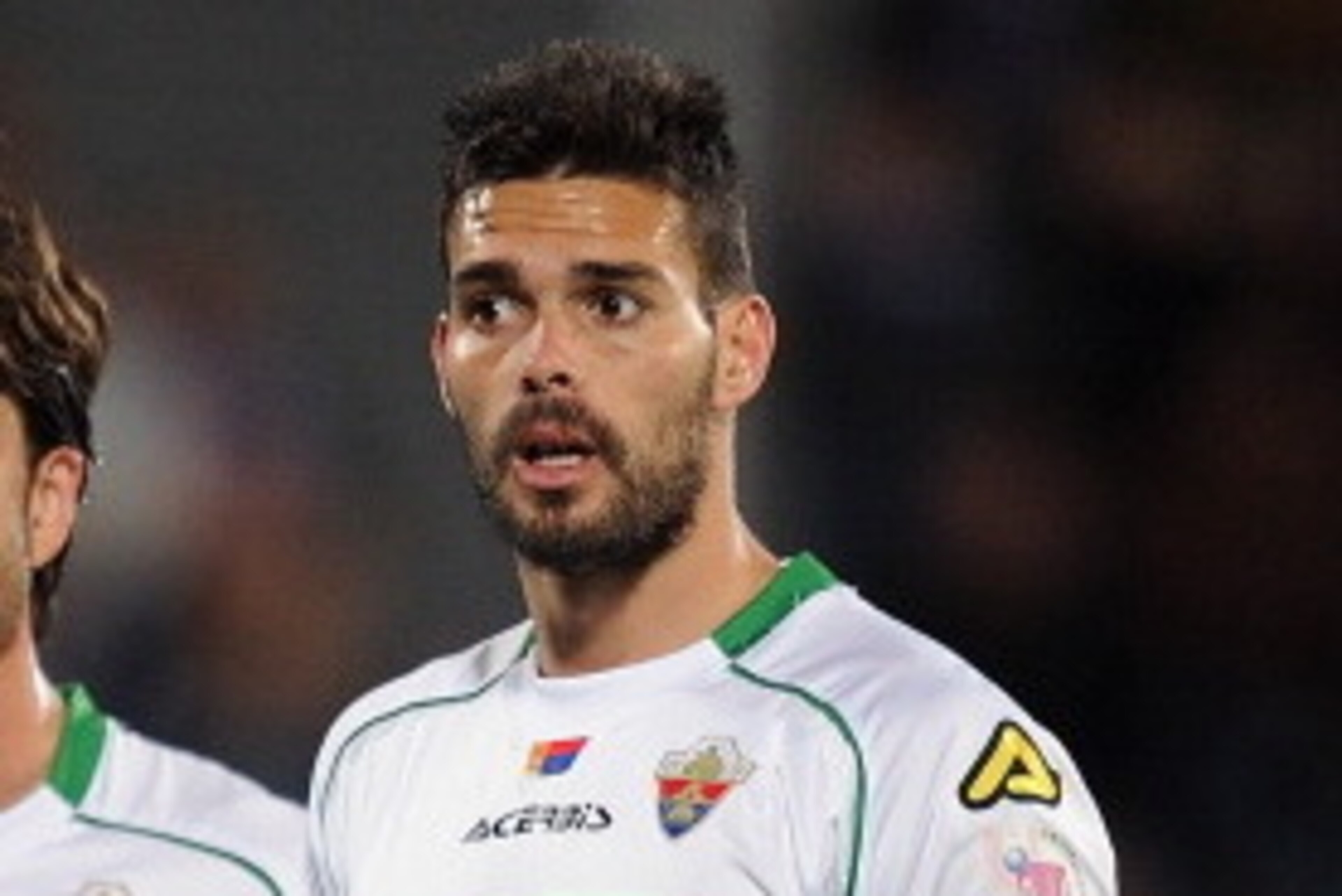 GETAFE, SPAIN - NOVEMBER 09:  Alberto Botia (R) and Domingo Cisma of Elche FC look on during the La Liga match between Getafe CF and Elche FC   at Coliseum Alfonso Perez stadium on November 9, 2013 in Getafe, Spain.  (Photo by Denis Doyle/Getty Images)