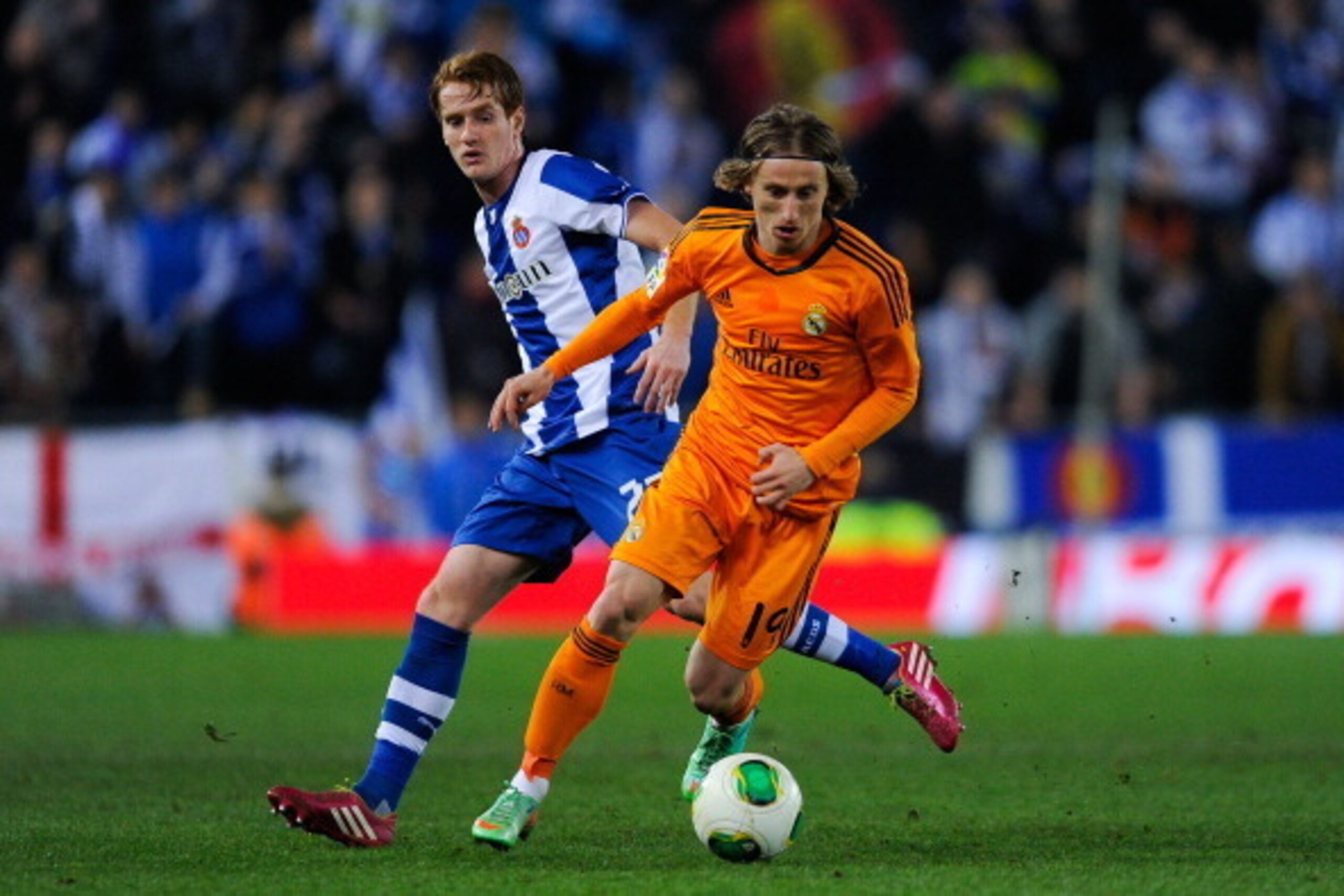 BARCELONA, SPAIN - JANUARY 21:  Luka Modric of Real Madrid CF duels for the ball with Alex of RCD Espanyol during the Copa del Rey Quarter Final First Leg match between RCD Espanyol and Real Madrid CF at Cornella-El Prat Stadium on January 21, 2014 in Bar