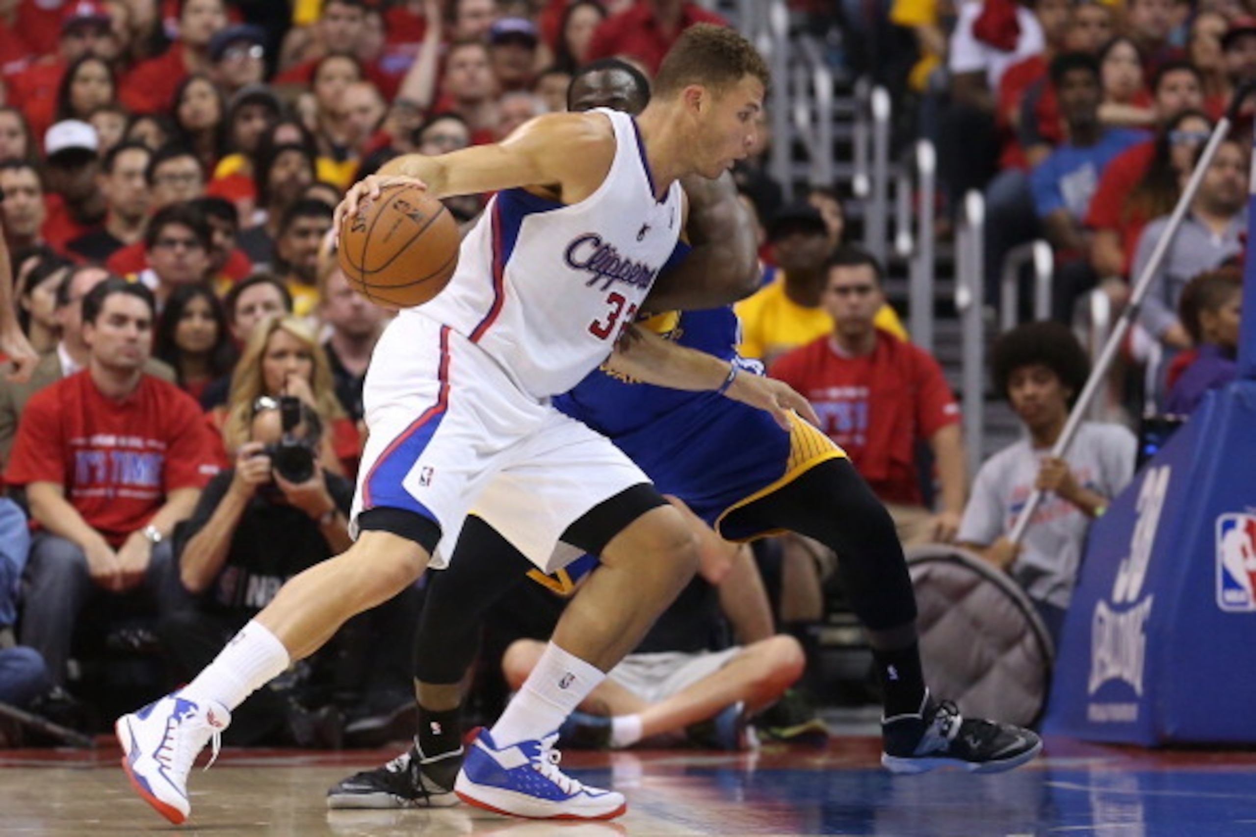 LOS ANGELES, CA - MAY 03:   Blake Griffin #32 of the Los Angeles Clippers drives against Draymond Green 323 of the Golden State Warriors in Game Seven of the Western Conference Quarterfinals during the 2014 NBA Playoffs at Staples Center on May 3, 2014 in