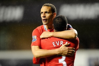 LONDON, ENGLAND - MARCH 04:  Rio Ferdinand of Manchester United hugs teammate Patrice Evra after victory in the Barclays Premier League match between Tottenham Hotspur and Manchester United at White Hart Lane on March 4, 2012 in London, England.  (Photo b