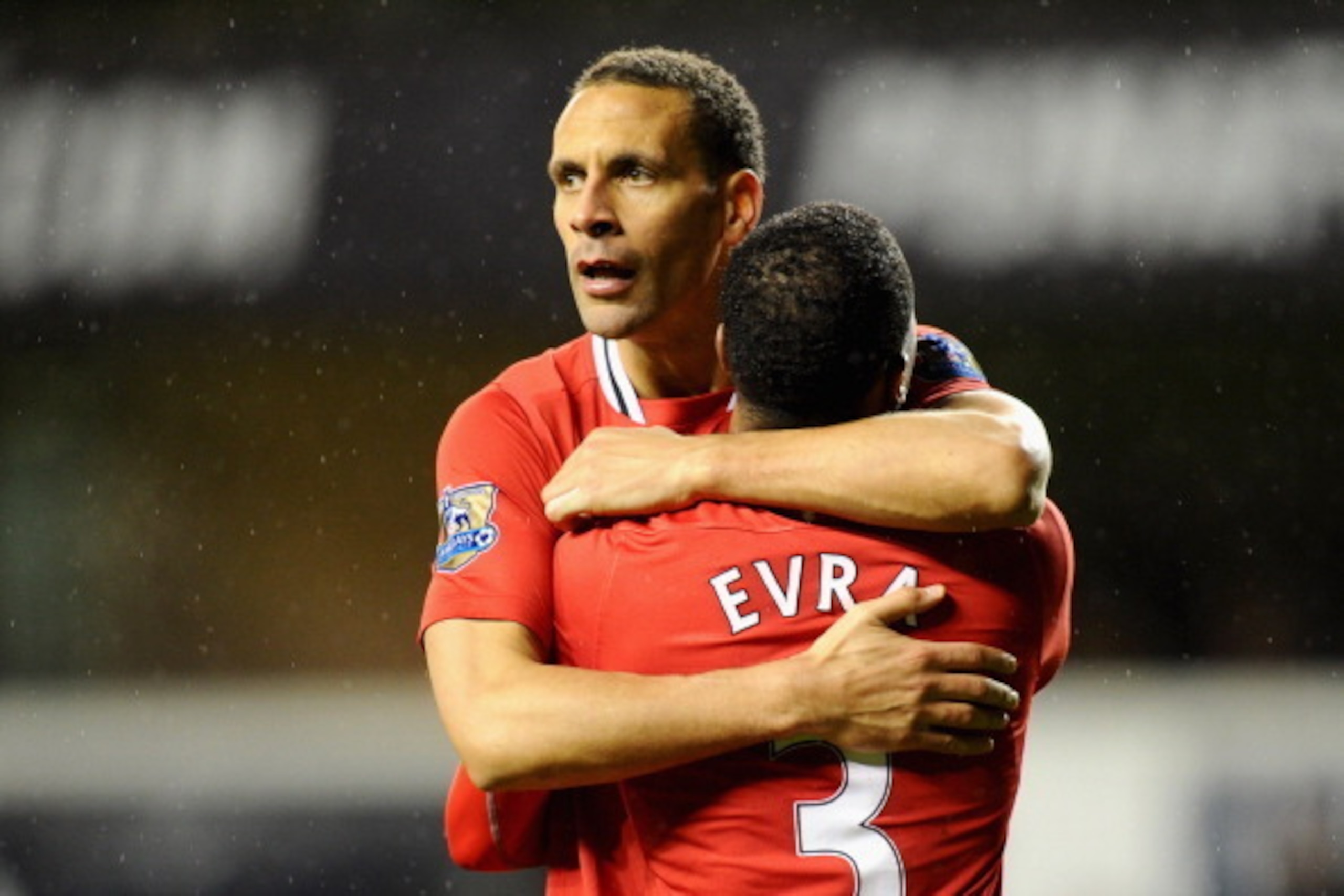 LONDON, ENGLAND - MARCH 04:  Rio Ferdinand of Manchester United hugs teammate Patrice Evra after victory in the Barclays Premier League match between Tottenham Hotspur and Manchester United at White Hart Lane on March 4, 2012 in London, England.  (Photo b