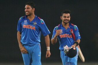 DHAKA, BANGLADESH - APRIL 04:  Virat Kohli of India and Yuvraj Singh celebrate after Kohli hit the winning runs as India won the ICC World Twenty20 Bangladesh 2014 2nd Semi-Final match between India and South Africa at Sher-e-Bangla Mirpur Stadium on Apri