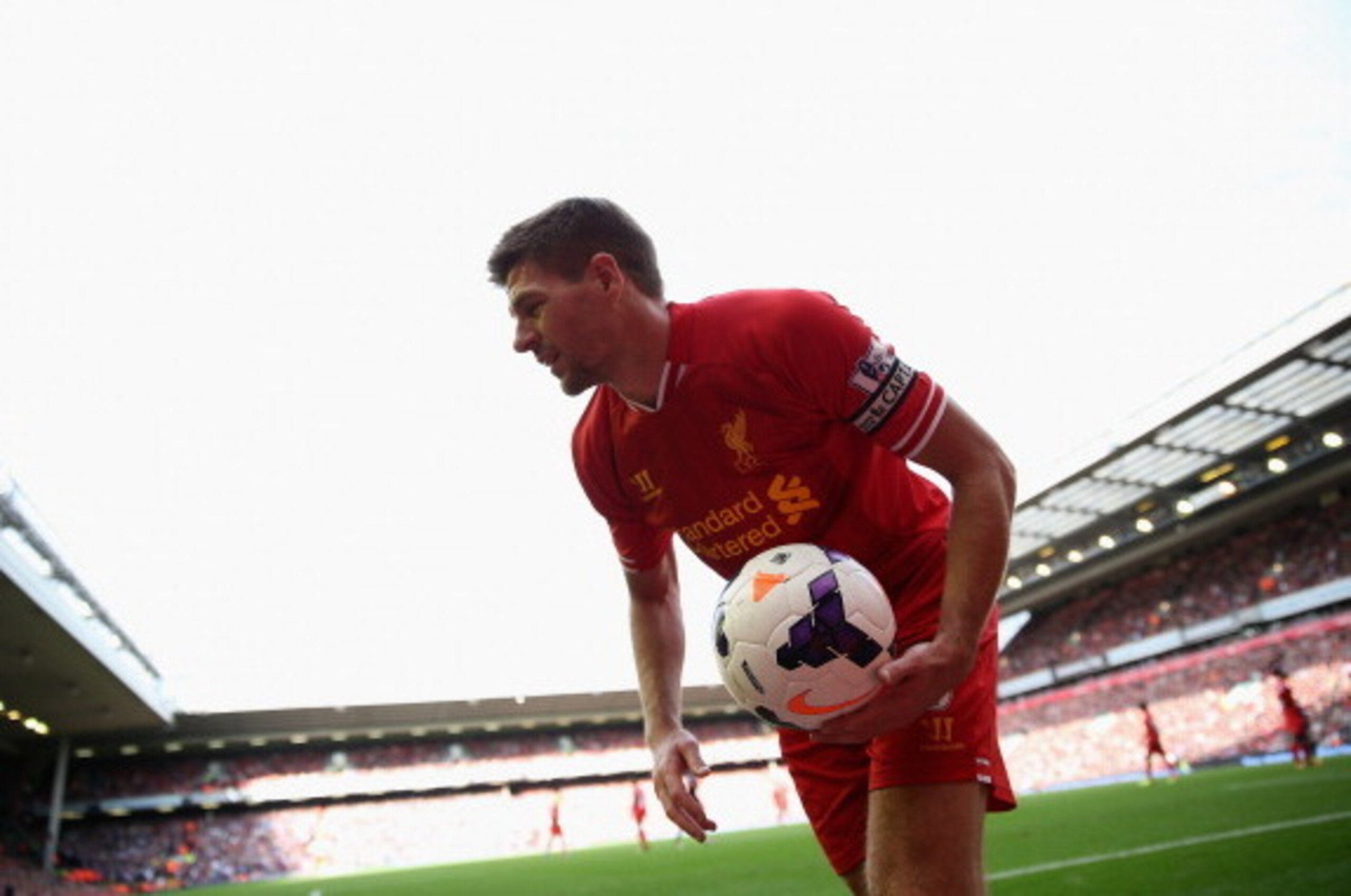 LIVERPOOL, ENGLAND - OCTOBER 05:  Steven Gerrard of Liverpool collects the ball to take a corner during the Barclays Premier League match between Liverpool and Crystal Palace at Anfield on October 5, 2013 in Liverpool, England.  (Photo by Clive Brunskill/