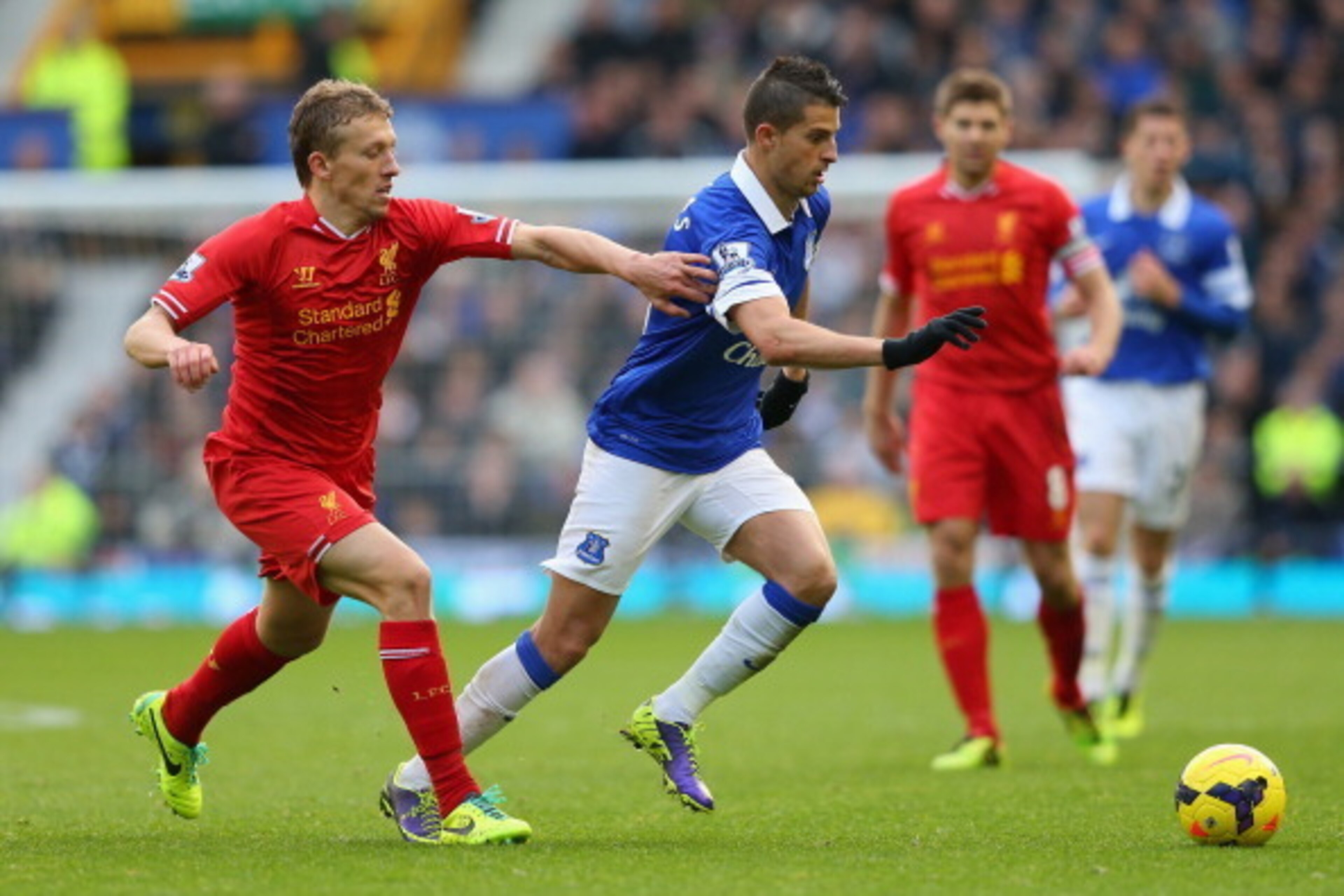 LIVERPOOL, ENGLAND - NOVEMBER 23:  Kevin Mirallas of Everton competes with Lucas of Liverpool during the Barclays Premier League match between Everton and Liverpool at Goodison Park on November 23, 2013 in Liverpool, England.  (Photo by Alex Livesey/Getty