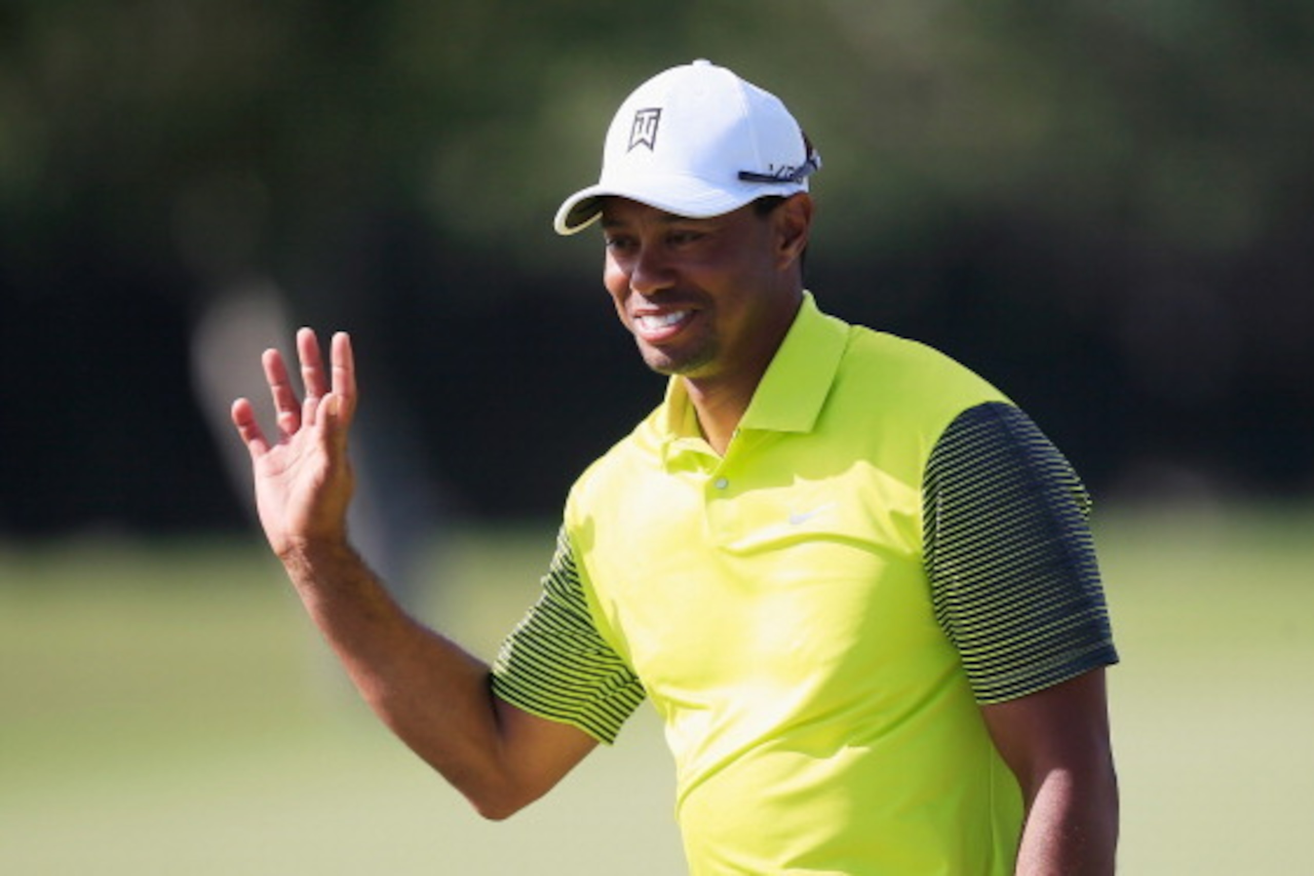 DORAL, FL - MARCH 07:  Tiger Woods reacts to a long birdie putt on the fourth hole during the second round of the World Golf Championships-Cadillac Championship at Trump National Doral on March 7, 2014 in Doral, Florida.  (Photo by Jamie Squire/Getty Imag
