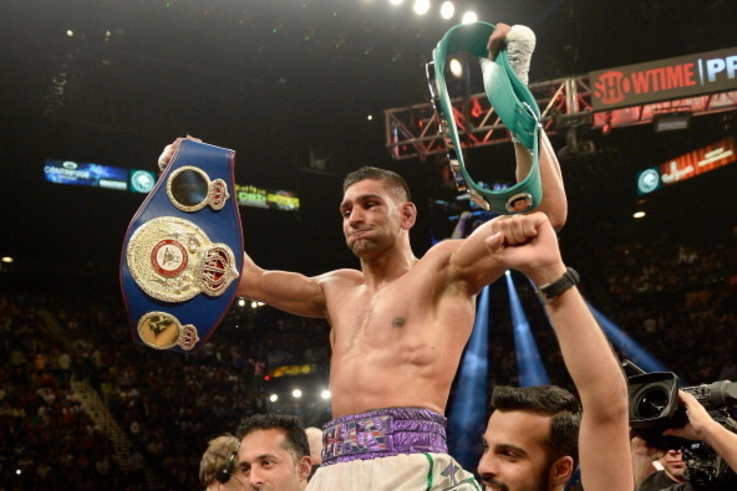 LAS VEGAS, NV - MAY 03:  Amir Khan celebrates his unanimous-decision victory against Luis Collazo after their welterweight bout at the MGM Grand Garden Arena on May 3, 2014 in Las Vegas, Nevada.  (Photo by Harry How/Getty Images)
