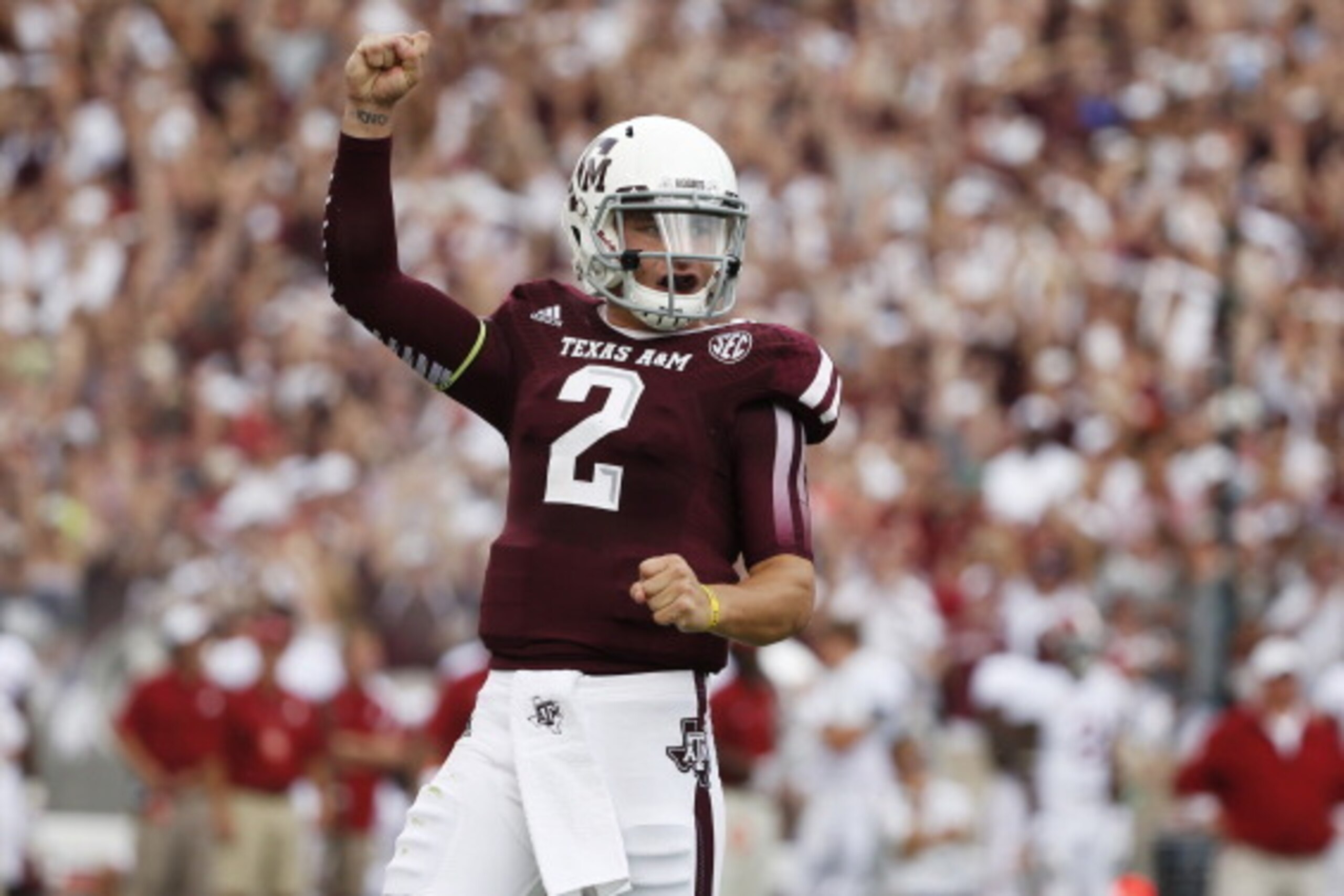 COLLEGE STATION, TX - SEPTEMBER 14:  Johnny Manziel #2 of the Texas A&M Aggies celebrates after throwing a first quarter touchdown during a game against the Alabama Crimson Tide at Kyle Field on September 14, 2013 in College Station, Texas.  (Photo by Sco