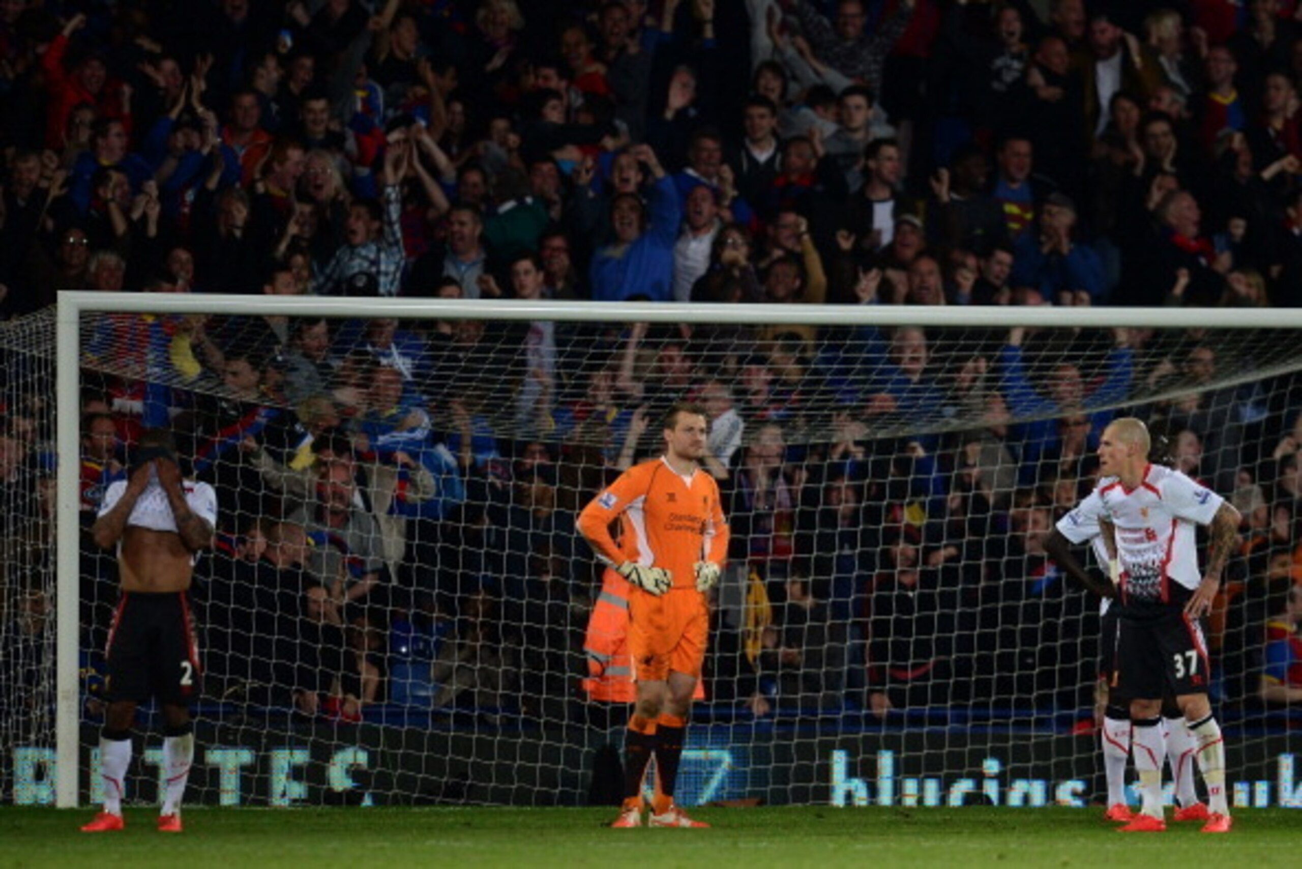 LONDON, ENGLAND - MAY 05:  Dejected Liverpool players look on as they head towards a 3-3 draw during the Barclays Premier League match between Crystal Palace and Liverpool at Selhurst Park on May 5, 2014 in London, England.  (Photo by Jamie McDonald/Getty