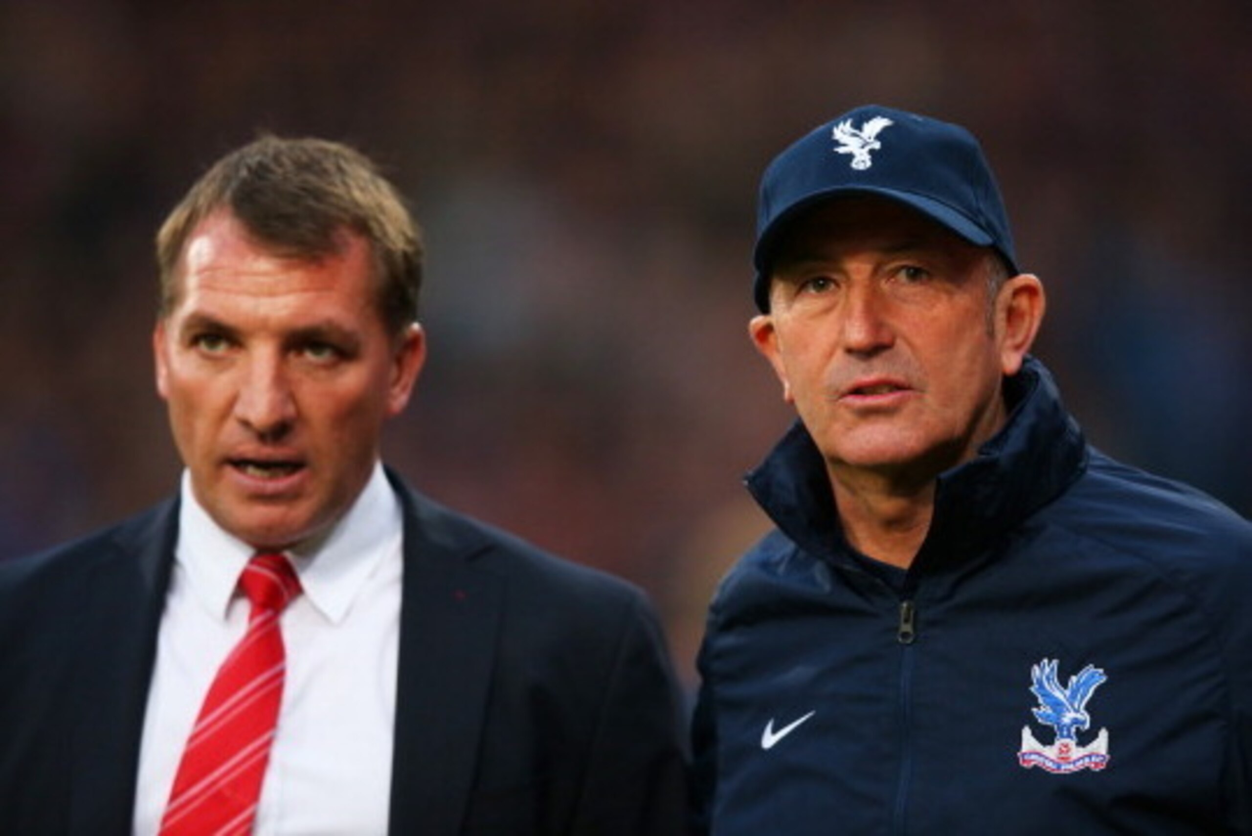 LONDON, ENGLAND - MAY 05:  (L-R) Brendan Rogers the Liverpool manager speaks with Tony Pulis the Crystal Palace manager prior to kickoff during the Barclays Premier League match between Crystal Palace and Liverpool at Selhurst Park on May 5, 2014 in Londo