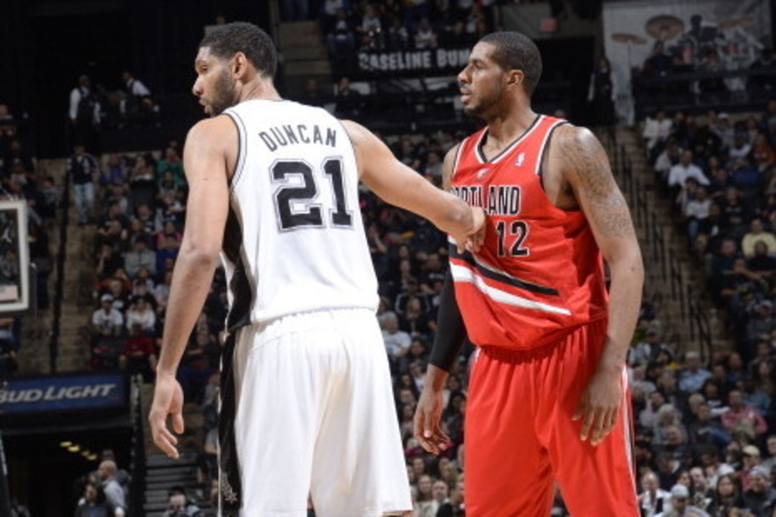SAN ANTONIO, TX - March 12: Tim Duncan #21 of the San Antonio Spurs guards his position against LaMarcus Aldridge #12 of the Portland Trail Blazers at the AT&T Center on March 12, 2014 in San Antonio, Texas. NOTE TO USER: User expressly acknowledges and a