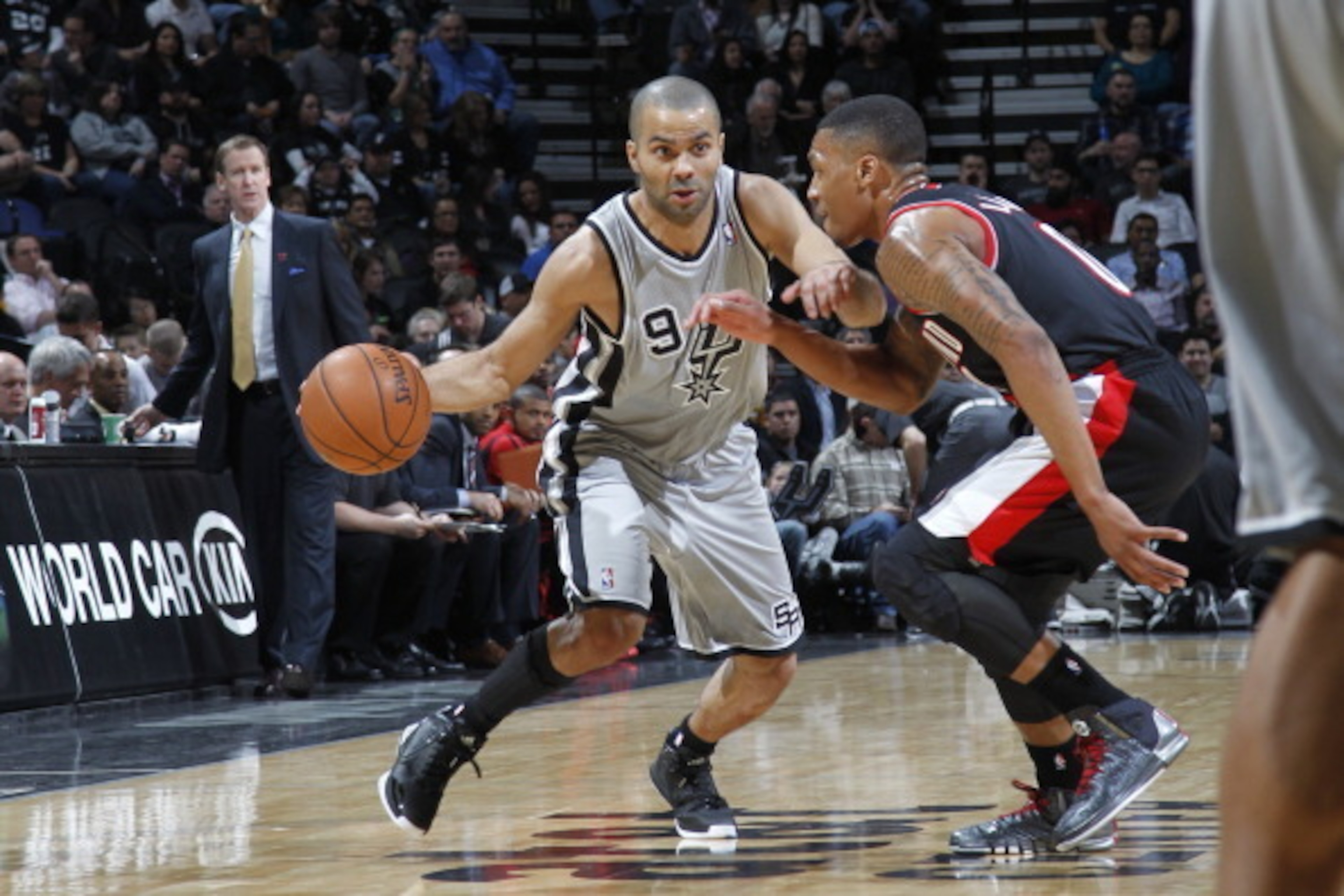 SAN ANTONIO, TX - JANUARY 17:  Tony Parker #9 of the San Antonio Spurs drives to the basket against the Portland Trail Blazers on January 17, 2014 at the AT&T Center in San Antonio, Texas. NOTE TO USER: User expressly acknowledges and agrees that, by down