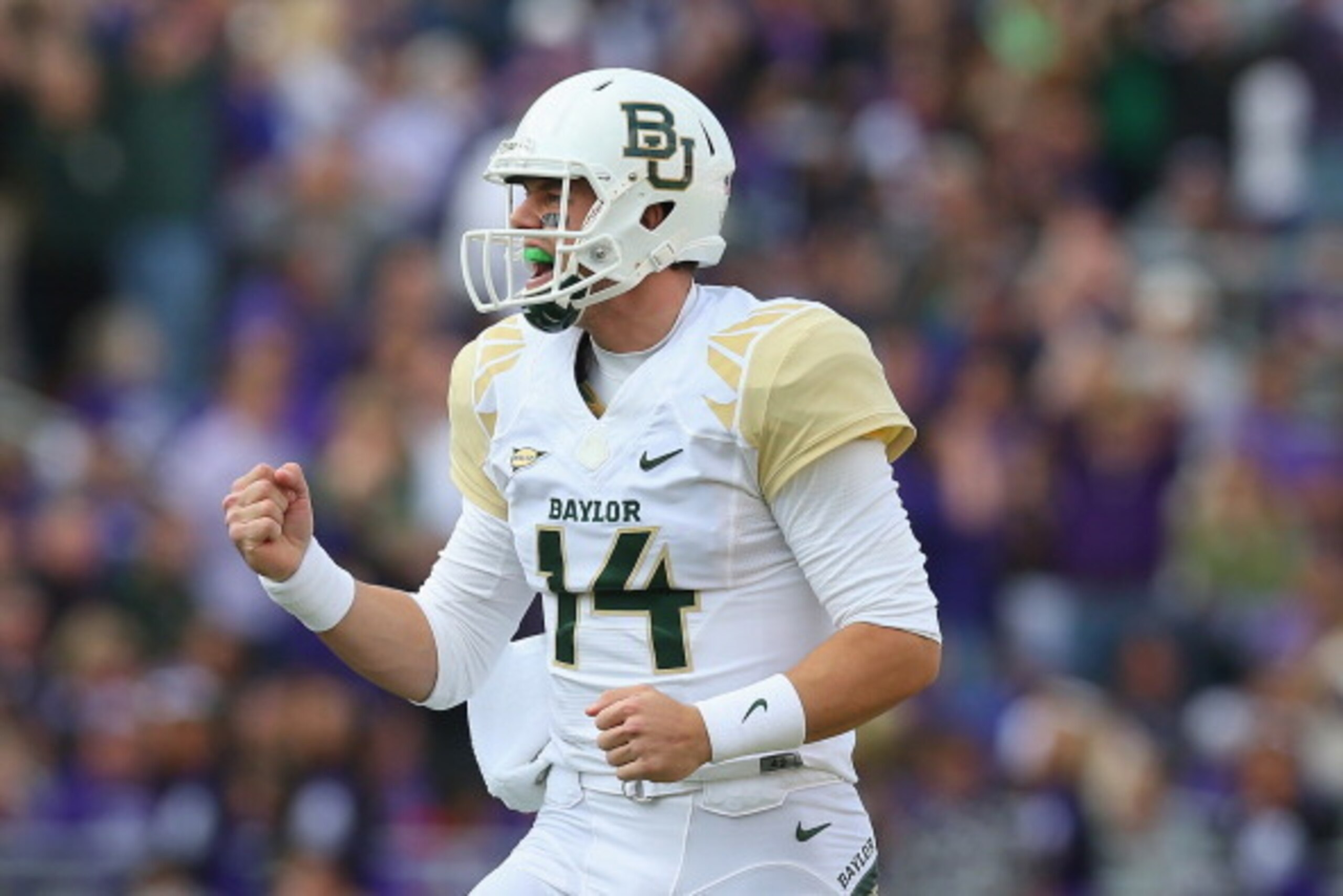 FORT WORTH, TX - NOVEMBER 30:  Bryce Petty #14 of the Baylor Bears celebrates a touchdown against the TCU Horned Frogs at Amon G. Carter Stadium on November 30, 2013 in Fort Worth, Texas.  (Photo by Ronald Martinez/Getty Images)