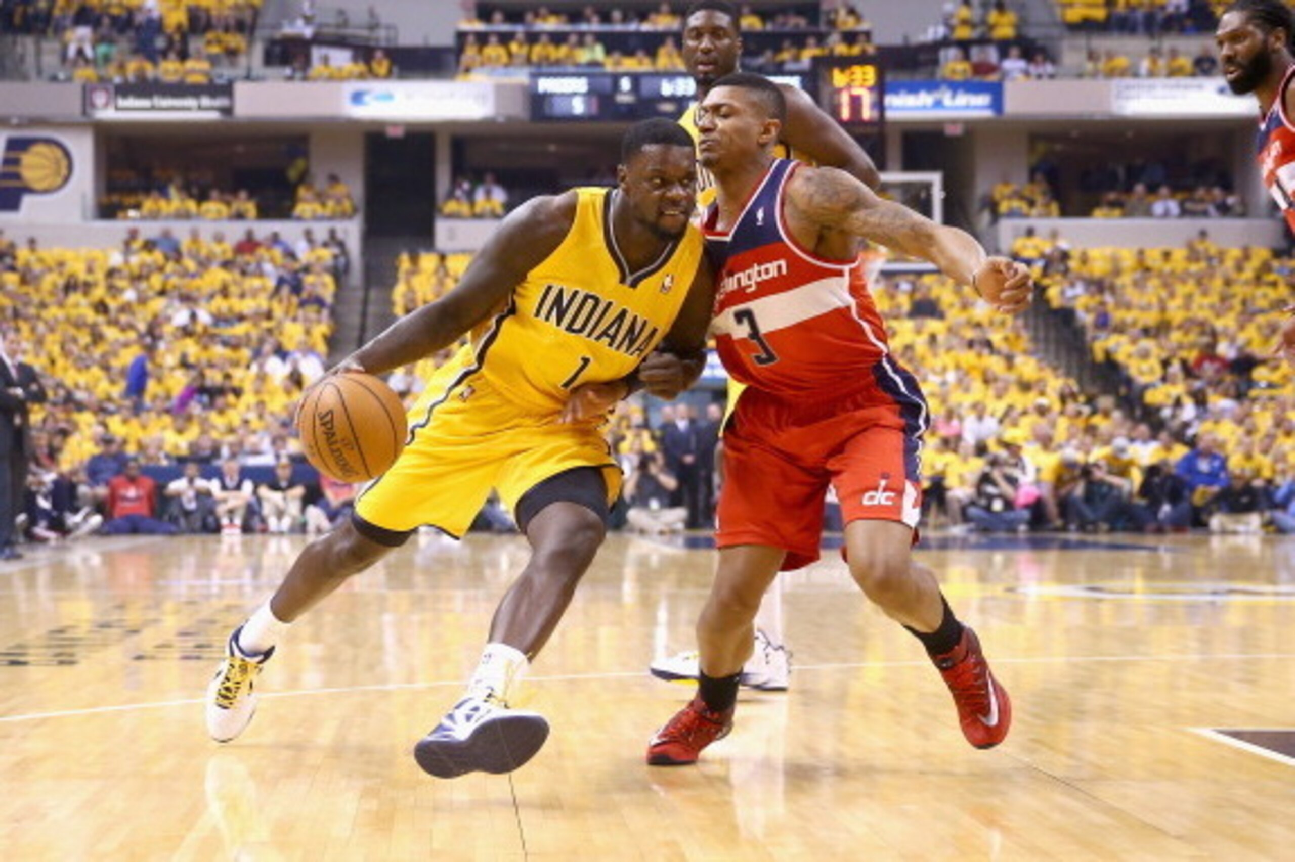 INDIANAPOLIS, IN - MAY 05: Lance Stephenson #1 of the Indiana Pacers dribbles the ball while defended by Bradley Beal #3 of the Washington Wizards in Game 1 of the Eastern Conference Semifinals during the 2014 NBA Playoffs at Bankers Life Fieldhouse on M INDIANAPOLIS, IN - MAY 05: Lance Stephenson #1 of the Indiana Pacers dribbles the ball while defended by Bradley Beal #3 of the Washington Wizards in Game 1 of the Eastern Conference Semifinals during the 2014 NBA Playoffs at Bankers Life Fieldhouse on M