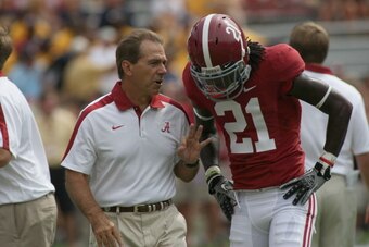 TUSCALOOSA, AL - SEPTEMBER 3:  Head coach Nick Saban and defensive back Dre Kirkpatrick #21 of the Alabama Crimson Tide during pre-game with the Kent State Golden Flashes on September 3, 2011 at Bryant Denny Stadium in Tuscaloosa, Alabama.  Alabama defeat