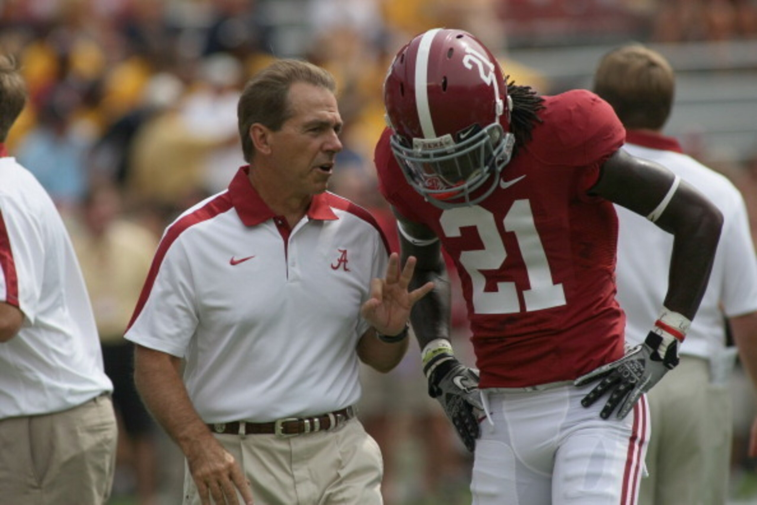 TUSCALOOSA, AL - SEPTEMBER 3:  Head coach Nick Saban and defensive back Dre Kirkpatrick #21 of the Alabama Crimson Tide during pre-game with the Kent State Golden Flashes on September 3, 2011 at Bryant Denny Stadium in Tuscaloosa, Alabama.  Alabama defeat