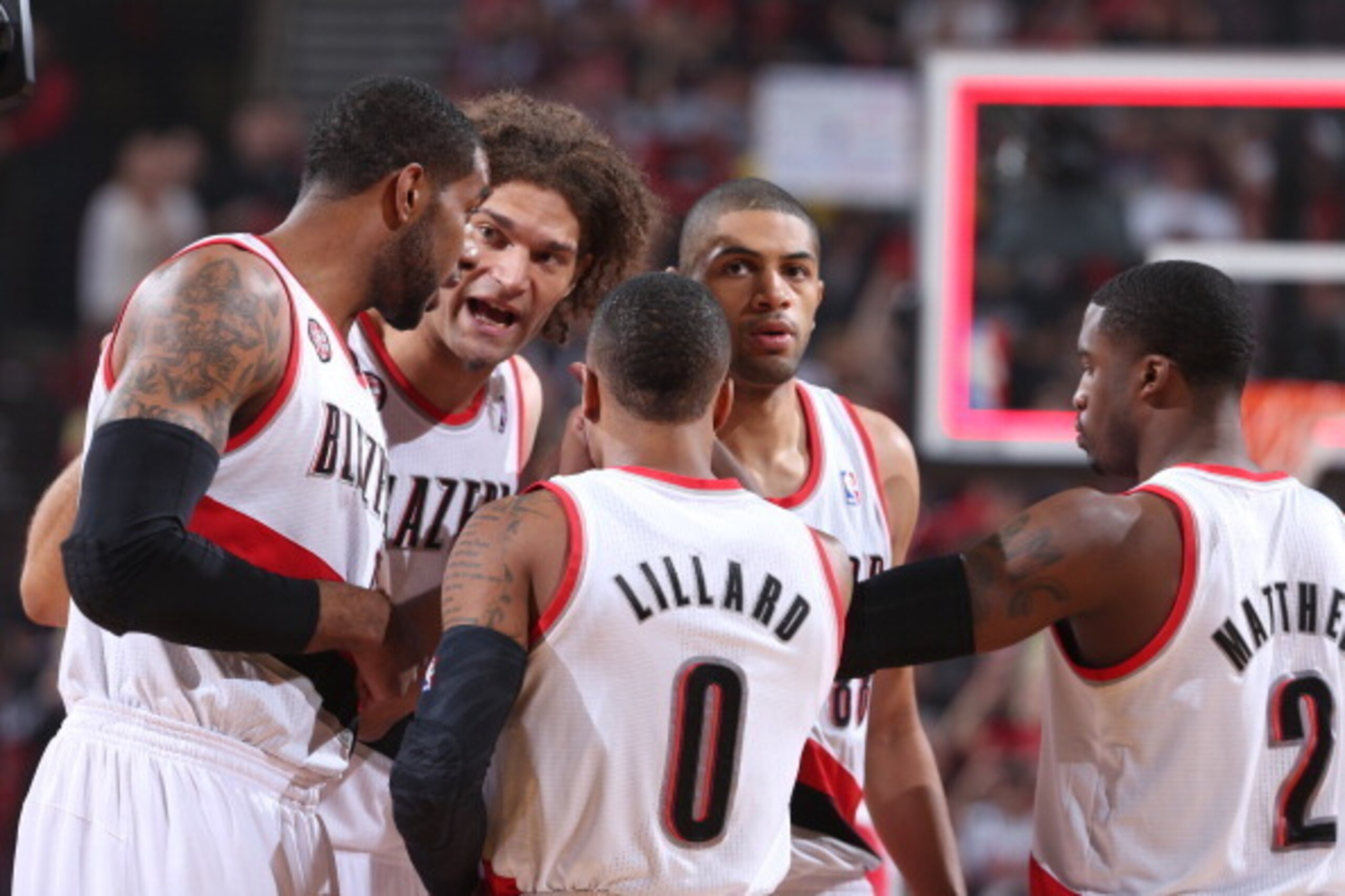PORTLAND, OR - MAY 2:  Damian Lillard #0 of the Portland Trail Blazers huddles up his team against the Houston Rockets in Game Six of the Western Conference Quarterfinals during the 2014 NBA Playoffs on May 2, 2014 at the Moda Center in Portland, Oregon. 
