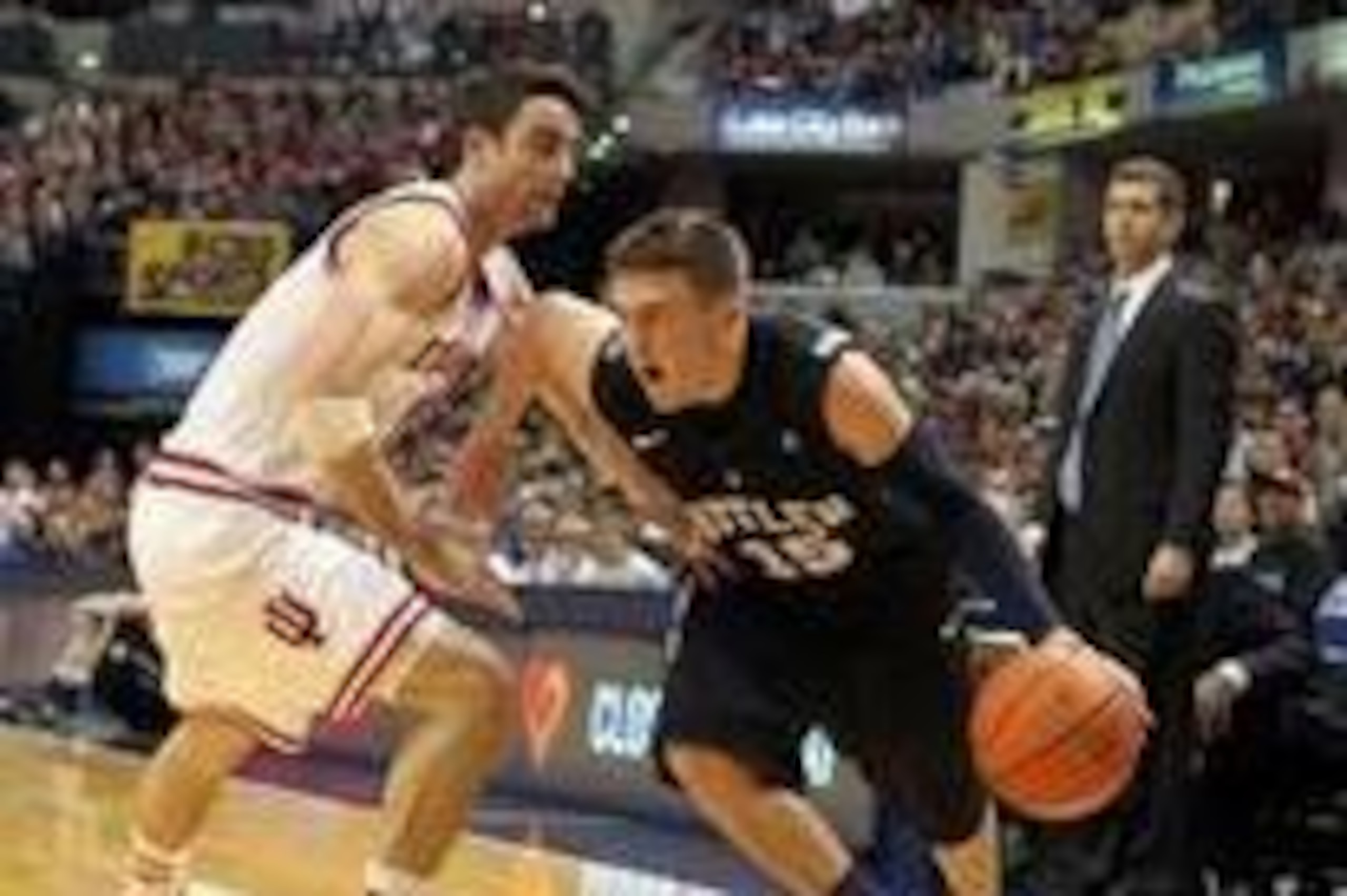 Dec 15 2012; Indianapolis, IN, USA; Butler Bulldogs guard Rotnei Clarke (15) drives to the basket against  Indiana Hoosiers guard Will Sheehey (0) at Bankers Life Fieldhouse. Butler defeats Indiana in overtime 88-86. Mandatory Credit: Brian Spurlock-USA T