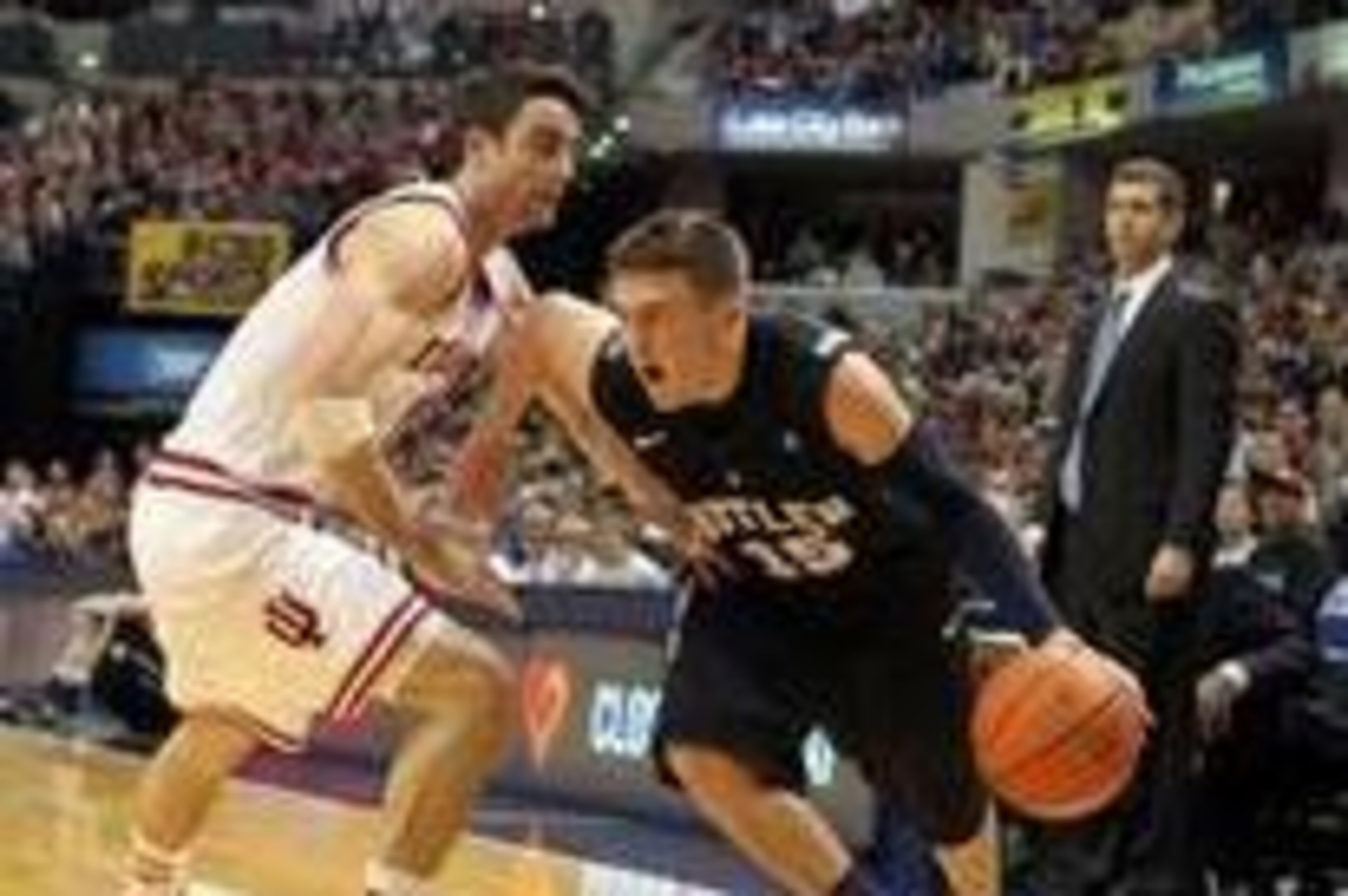 Dec 15 2012; Indianapolis, IN, USA; Butler Bulldogs guard Rotnei Clarke (15) drives to the basket against  Indiana Hoosiers guard Will Sheehey (0) at Bankers Life Fieldhouse. Butler defeats Indiana in overtime 88-86. Mandatory Credit: Brian Spurlock-USA T