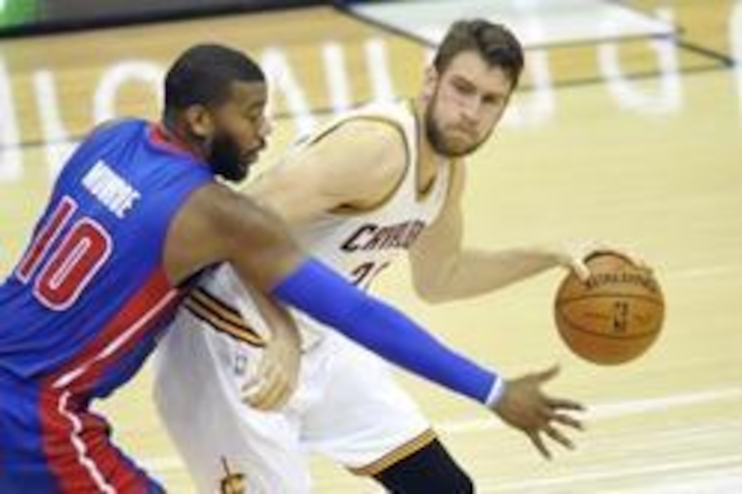 Apr 9, 2014; Cleveland, OH, USA; Cleveland Cavaliers center Spencer Hawes (32) dribbles the ball in front of Detroit Pistons forward Greg Monroe (10) in the second quarter at Quicken Loans Arena. Mandatory Credit: David Richard-USA TODAY Sports
