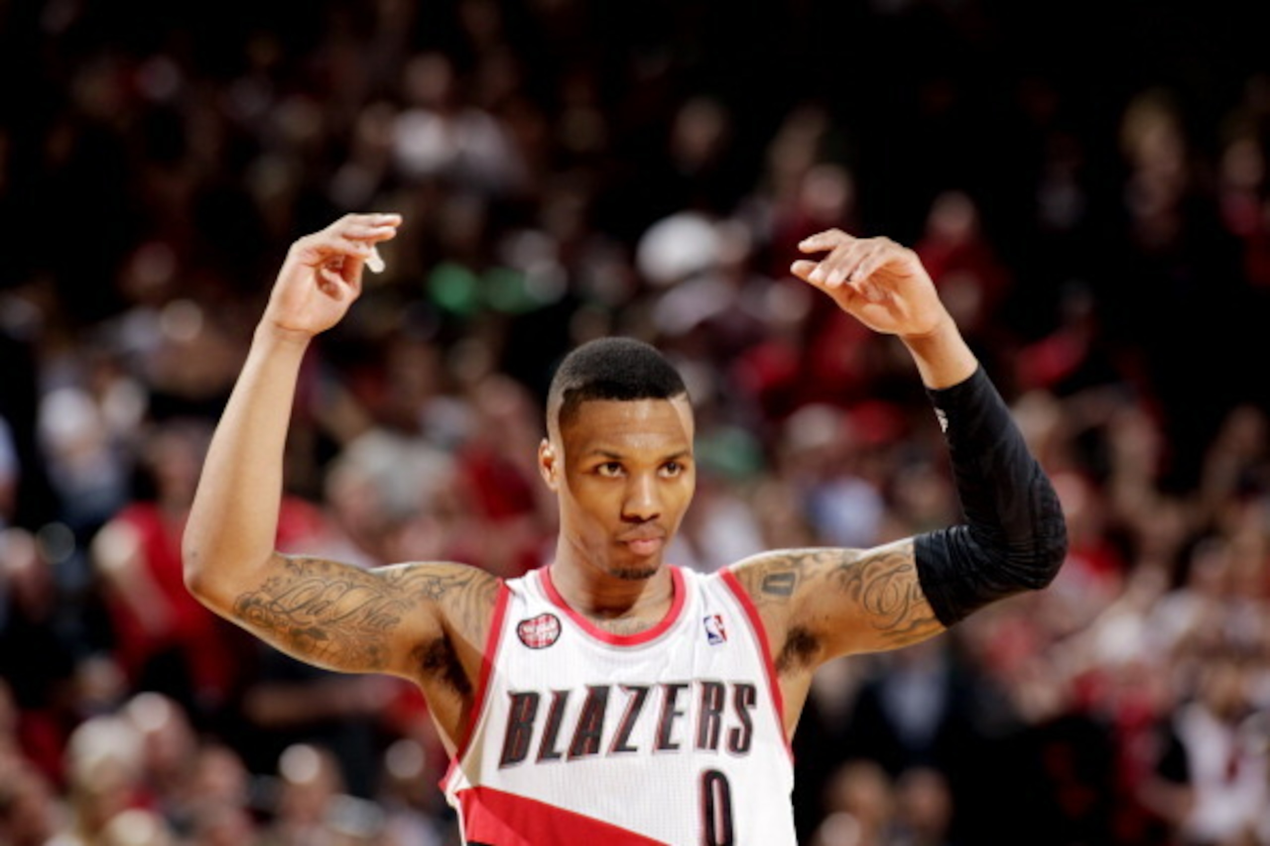 PORTLAND, OR - MAY 2: Damian Lillard #0 of the Portland Trail Blazers celebrates during a game against the Houston Rockets in Game Six of the Western Conference Quarterfinals during the 2014 NBA Playoffs on May 2, 2014 at the Moda Center in Portland, Oreg PORTLAND, OR - MAY 2: Damian Lillard #0 of the Portland Trail Blazers celebrates during a game against the Houston Rockets in Game Six of the Western Conference Quarterfinals during the 2014 NBA Playoffs on May 2, 2014 at the Moda Center in Portland, Oreg
