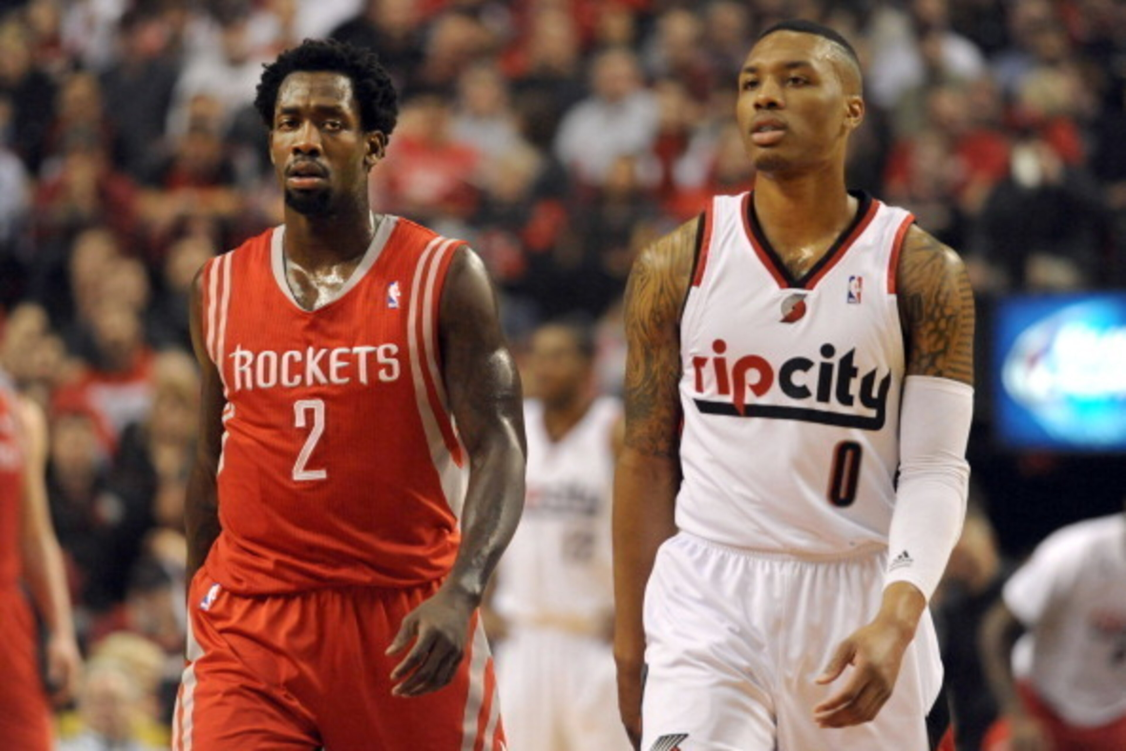 PORTLAND, OR - APRIL  25: Patrick Beverley #2 of the Houston Rockets keeps an eye on Damian Lillard #0 of the Portland Trail Blazers during the first quarter of Game Three of the Western Conference Quarterfinals during the 2014 NBA Playoffs at the Moda Ce