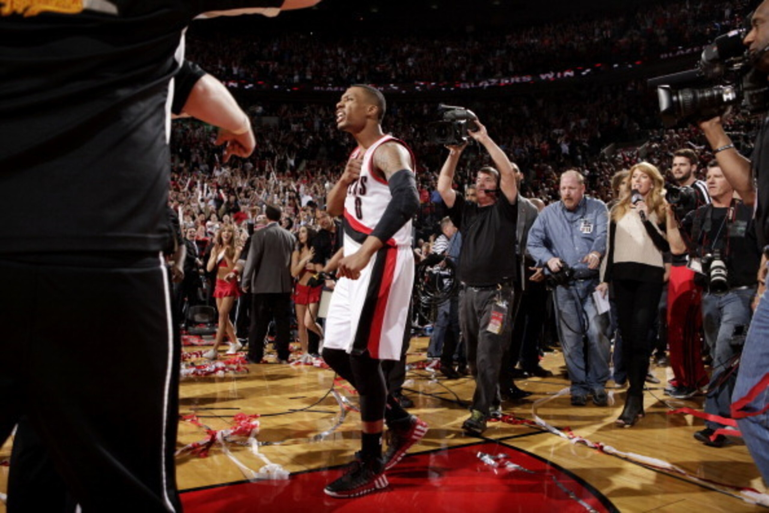 PORTLAND, OR - MAY 2: Damian Lillard #0 of the Portland Trail Blazers celebrates after winning against the Houston Rockets in Game Six of the Western Conference Quarterfinals during the 2014 NBA Playoffs on May 2, 2014 at the Moda Center in Portland, Oreg PORTLAND, OR - MAY 2: Damian Lillard #0 of the Portland Trail Blazers celebrates after winning against the Houston Rockets in Game Six of the Western Conference Quarterfinals during the 2014 NBA Playoffs on May 2, 2014 at the Moda Center in Portland, Oreg