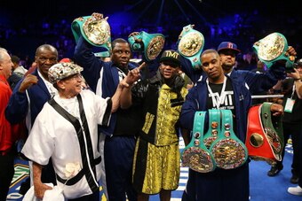 LAS VEGAS, NV - MAY 04:  Floyd Mayweather Jr. celebrates his unanimous decision victory with his team against Robert Guerrero in their WBC welterweight title bout at the MGM Grand Garden Arena on May 4, 2013 in Las Vegas, Nevada.  (Photo by Al Bello/Getty