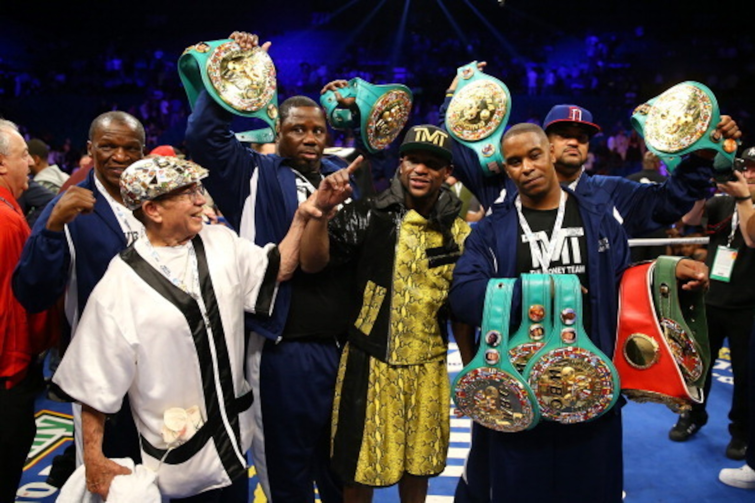 LAS VEGAS, NV - MAY 04:  Floyd Mayweather Jr. celebrates his unanimous decision victory with his team against Robert Guerrero in their WBC welterweight title bout at the MGM Grand Garden Arena on May 4, 2013 in Las Vegas, Nevada.  (Photo by Al Bello/Getty
