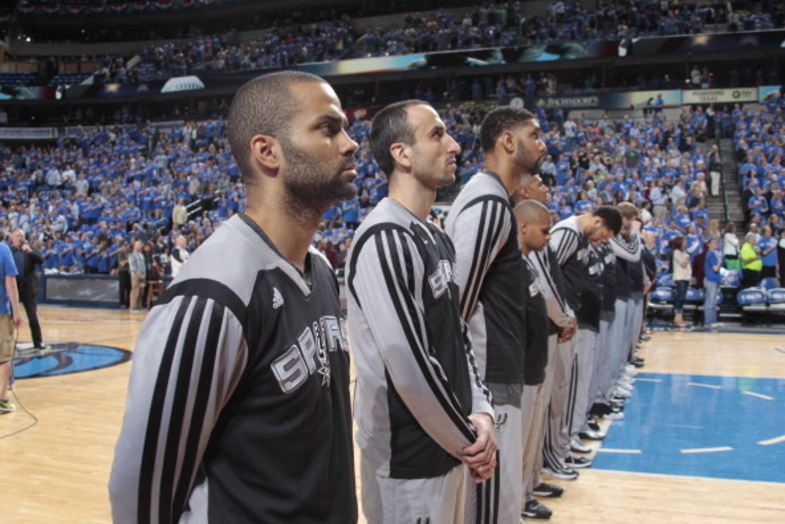 DALLAS, TX - MAY 2: Tony Parker #9, Manu Ginobili #20, and Tim Duncan #21 of the San Antonio Spurs stand during the National Anthem prior to tip off against the Dallas Mavericks during Game Six of the Western Conference Quarterfinals during the 2014 NBA P