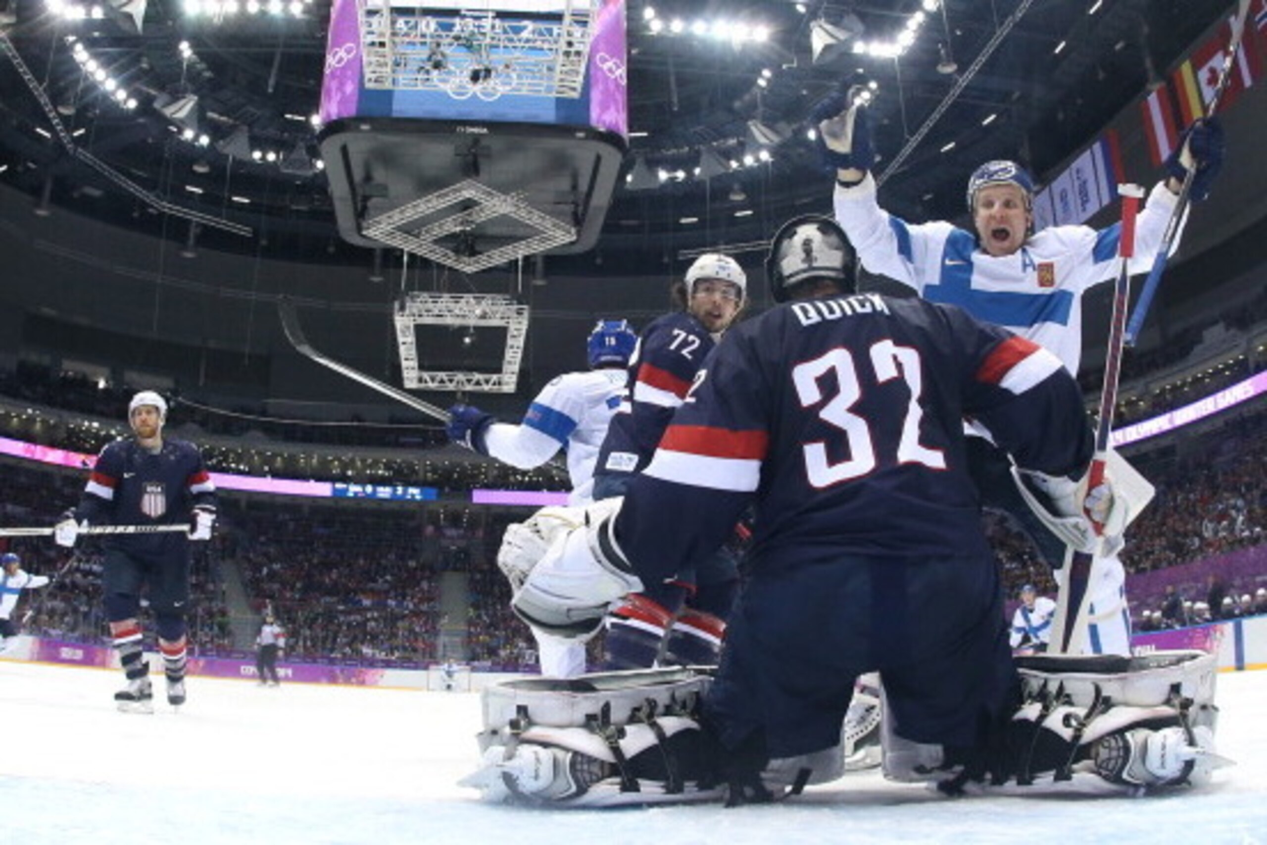 SOCHI, RUSSIA - FEBRUARY 22: Leo Komarov #71 and Tuomo Ruutu #15 of Finland celebrate a goal by Juuso Hietanen #38 in the third period against Jonathan Quick #32 of the United States during the Men's Ice Hockey Bronze Medal Game on Day 15 of the 2014 Soch