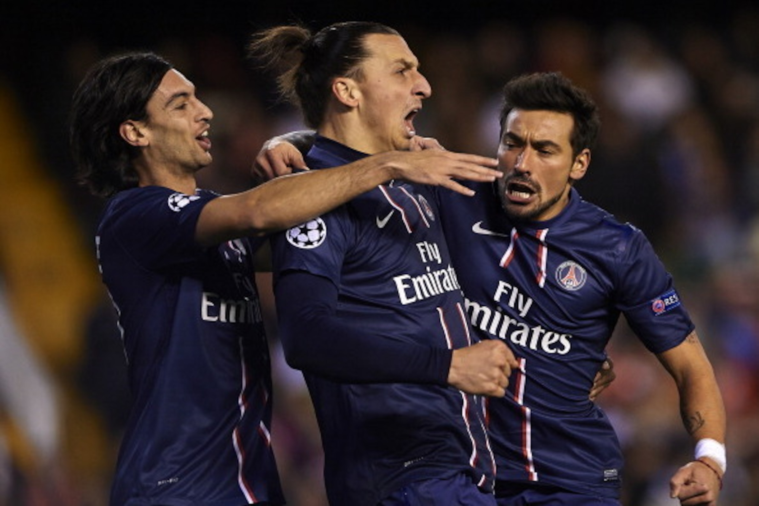VALENCIA, SPAIN - FEBRUARY 12:  Ezequiel Lavezzi (R) of Paris Saint-Germain celebrates scoring with his team-mate Zlatan Ibrahimovic and Javier Pastore (L) during the UEFA Champions League Round of 16 first leg match between Valencia CF and Paris St Germa