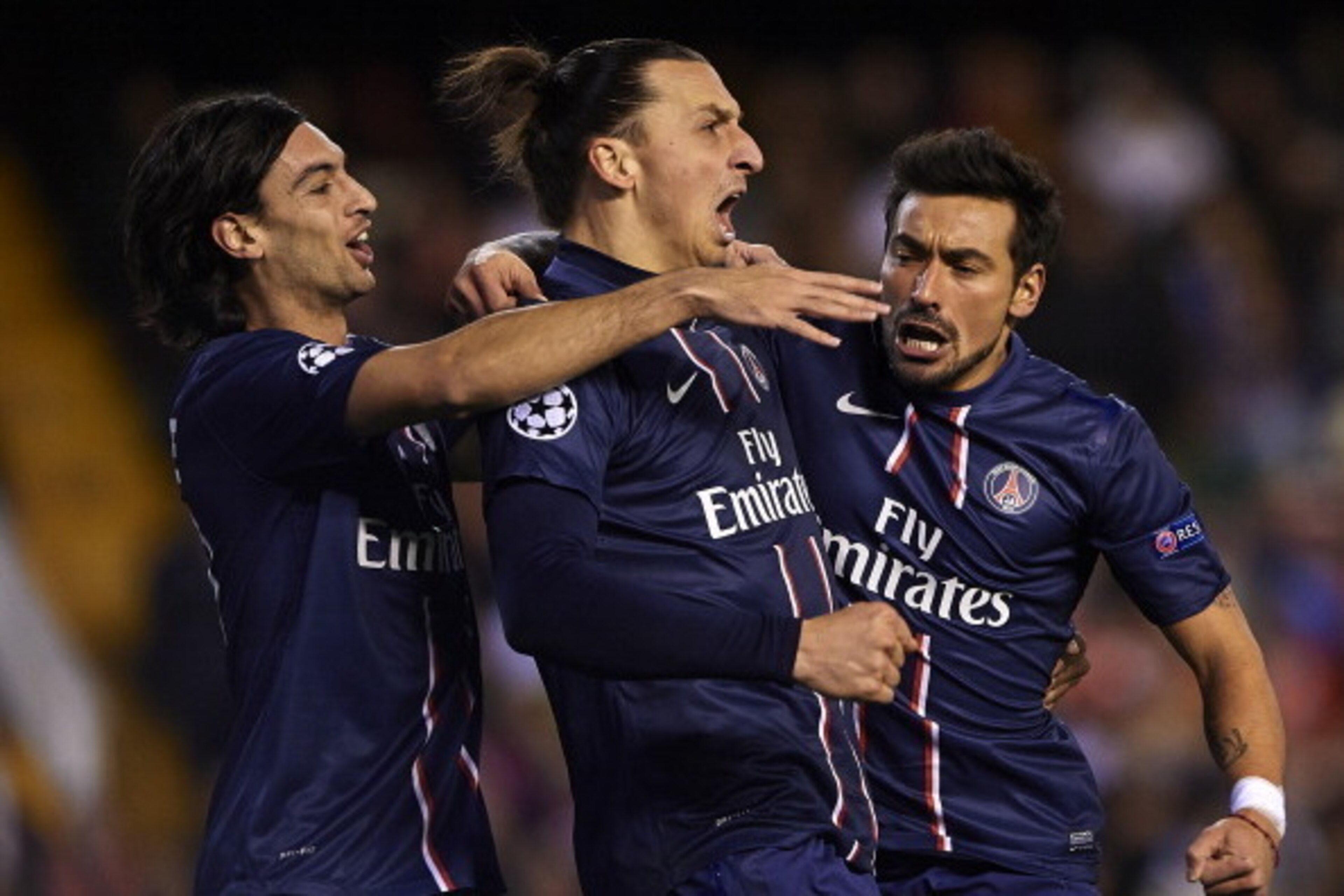 VALENCIA, SPAIN - FEBRUARY 12:  Ezequiel Lavezzi (R) of Paris Saint-Germain celebrates scoring with his team-mate Zlatan Ibrahimovic and Javier Pastore (L) during the UEFA Champions League Round of 16 first leg match between Valencia CF and Paris St Germa