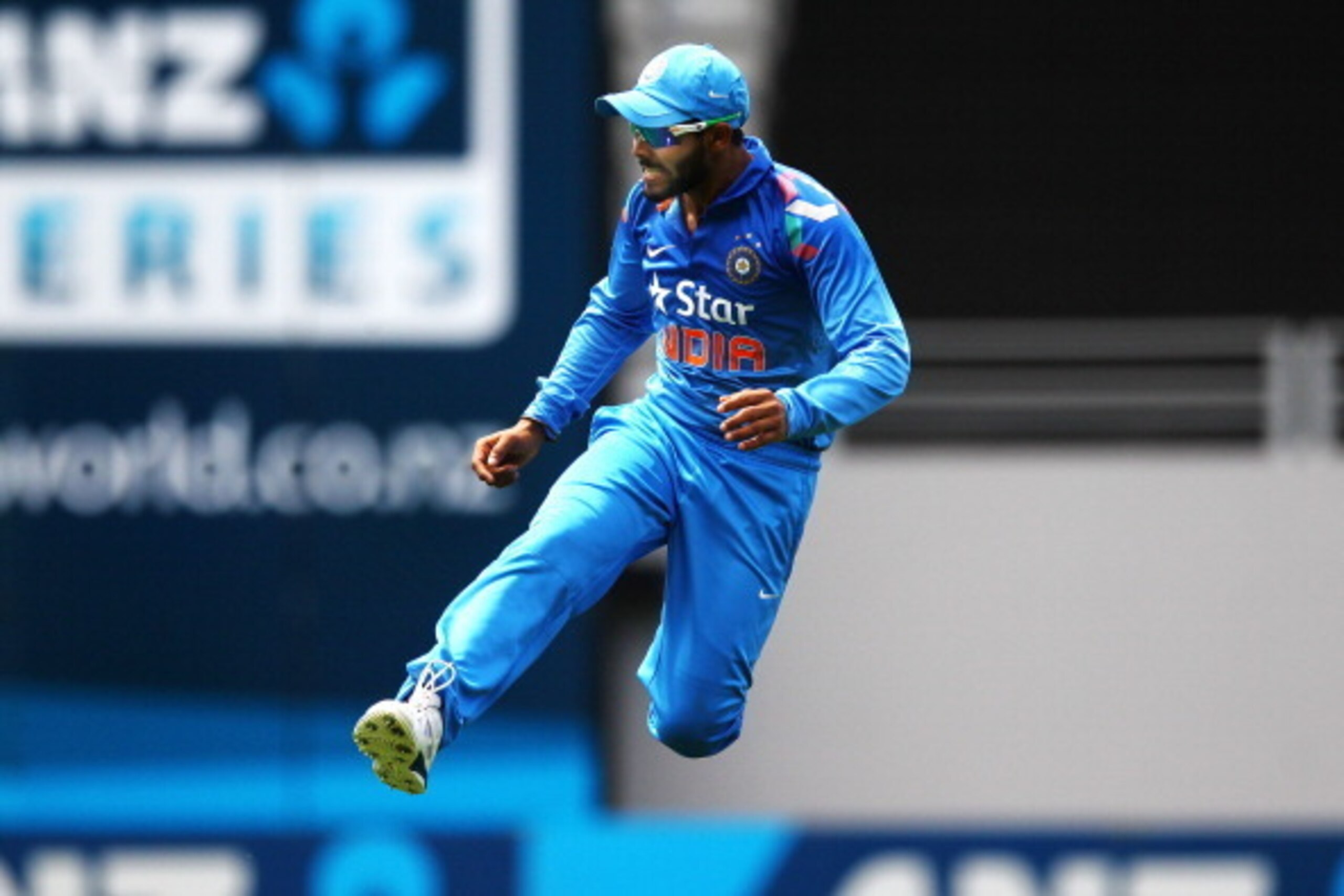 AUCKLAND, NEW ZEALAND - JANUARY 25: Ravindra Jadeja of India gets up in the air fielding a ball during the One Day International match between New Zealand and India at Eden Park on January 25, 2014 in Auckland, New Zealand.  (Photo by Anthony Au-Yeung/Get