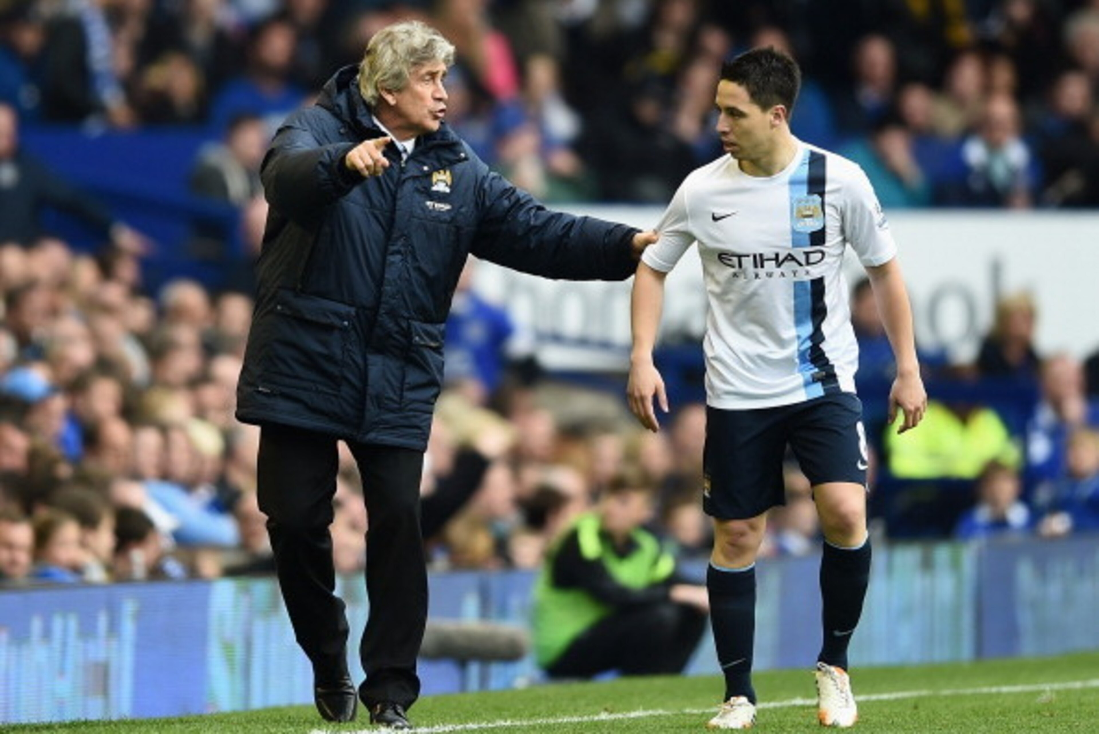 LIVERPOOL, ENGLAND - MAY 03: Manchester City Manager Manuel Pellegrini gives orders to Samir Nasri during the Barclays Premier League match between Everton and Manchester City at Goodison Park on May 3, 2014 in Liverpool, England. (Photo by Laurence Gr LIVERPOOL, ENGLAND - MAY 03: Manchester City Manager Manuel Pellegrini gives orders to Samir Nasri during the Barclays Premier League match between Everton and Manchester City at Goodison Park on May 3, 2014 in Liverpool, England. (Photo by Laurence Gr