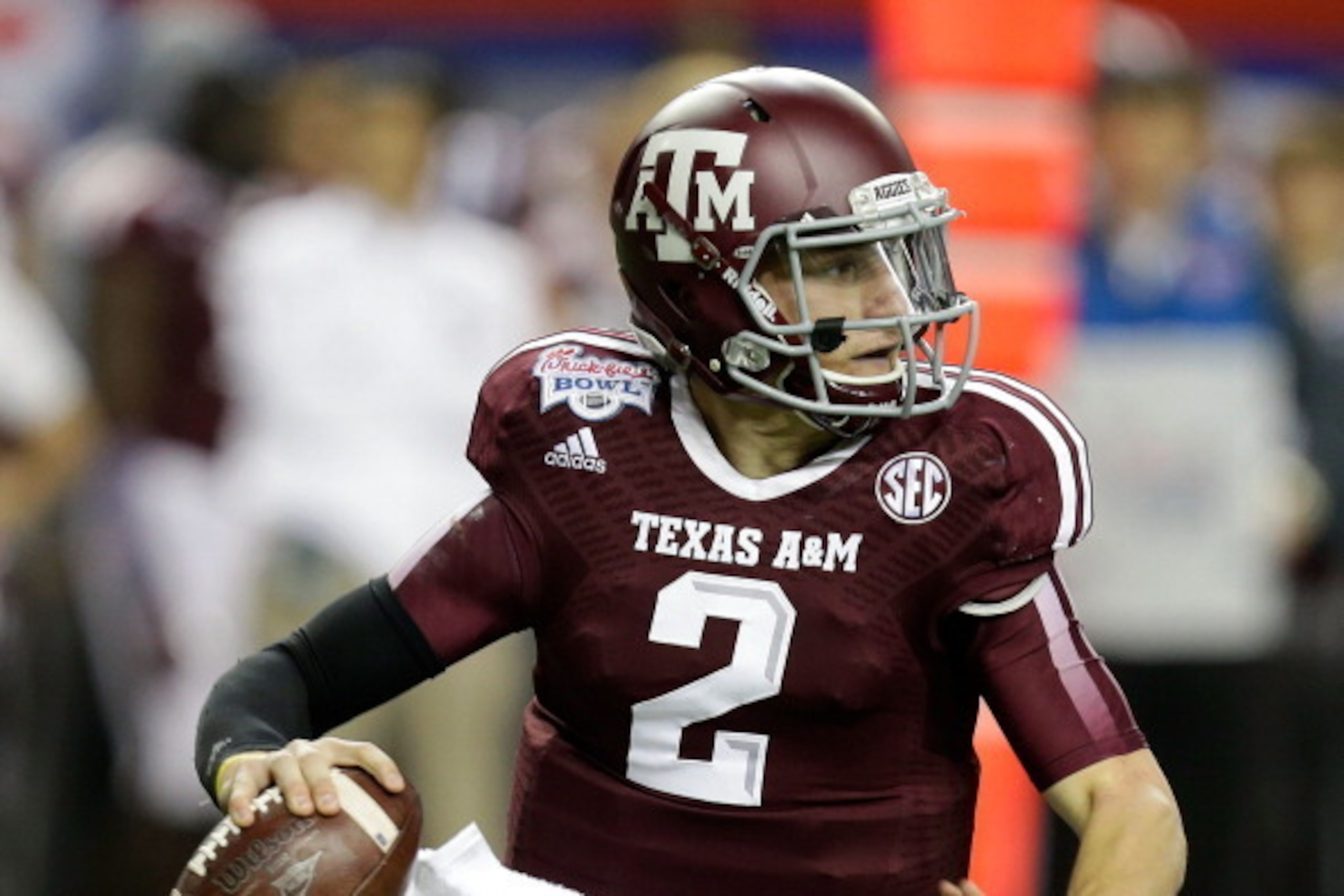 ATLANTA, GA - DECEMBER 31:  Quarterback Johnny Manziel #2 of the Texas A&M Aggies rolls out and looks downfield to pass during the the Chick-fil-A Bowl game against the Duke Blue Devils at the Georgia Dome on December 31, 2013 in Atlanta, Georgia.  (Photo