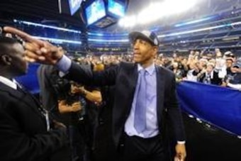 Apr 7, 2014; Arlington, TX, USA; Connecticut Huskies head coach Kevin Ollie gestures to fans after defeating the Kentucky Wildcats in the championship game of the Final Four in the 2014 NCAA Mens Division I Championship tournament at AT&T Stadium. Mandato