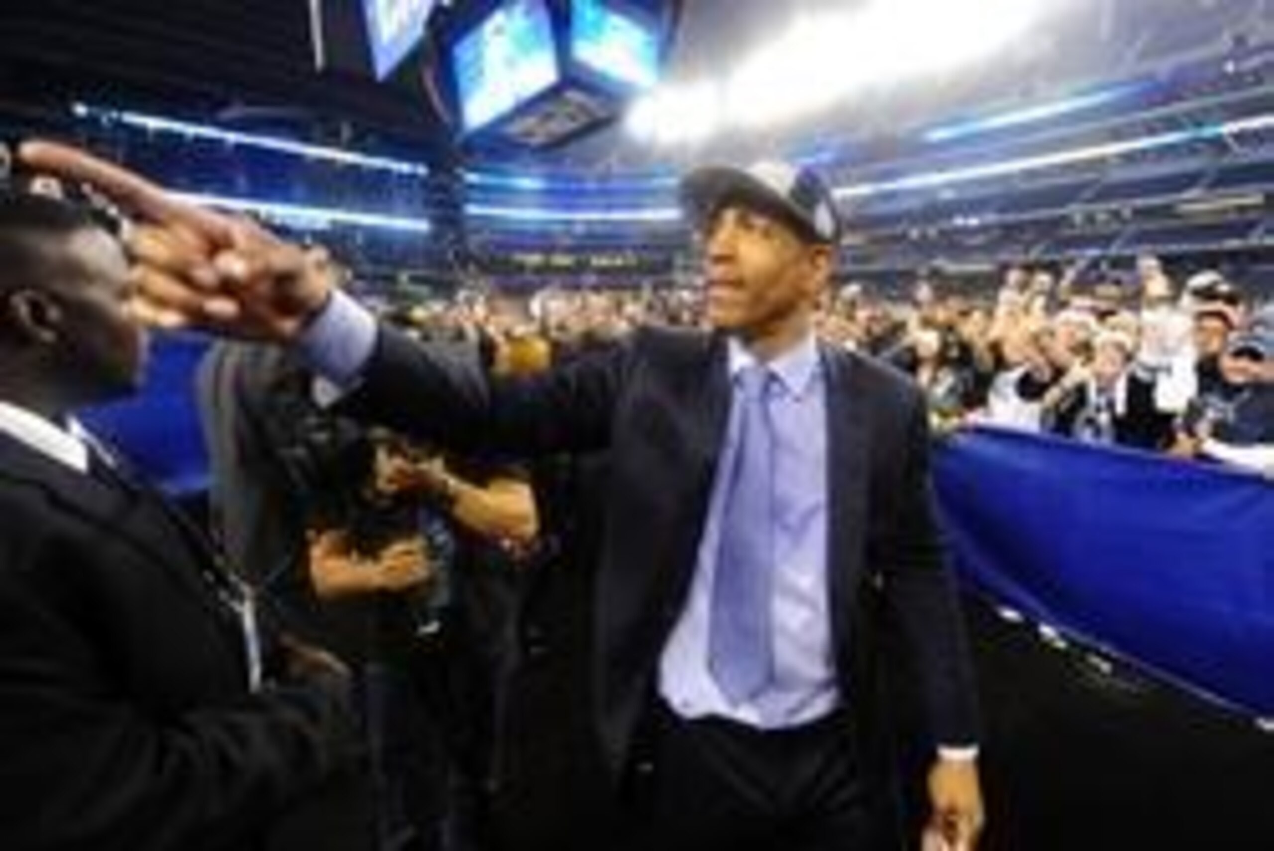 Apr 7, 2014; Arlington, TX, USA; Connecticut Huskies head coach Kevin Ollie gestures to fans after defeating the Kentucky Wildcats in the championship game of the Final Four in the 2014 NCAA Mens Division I Championship tournament at AT&T Stadium. Mandato