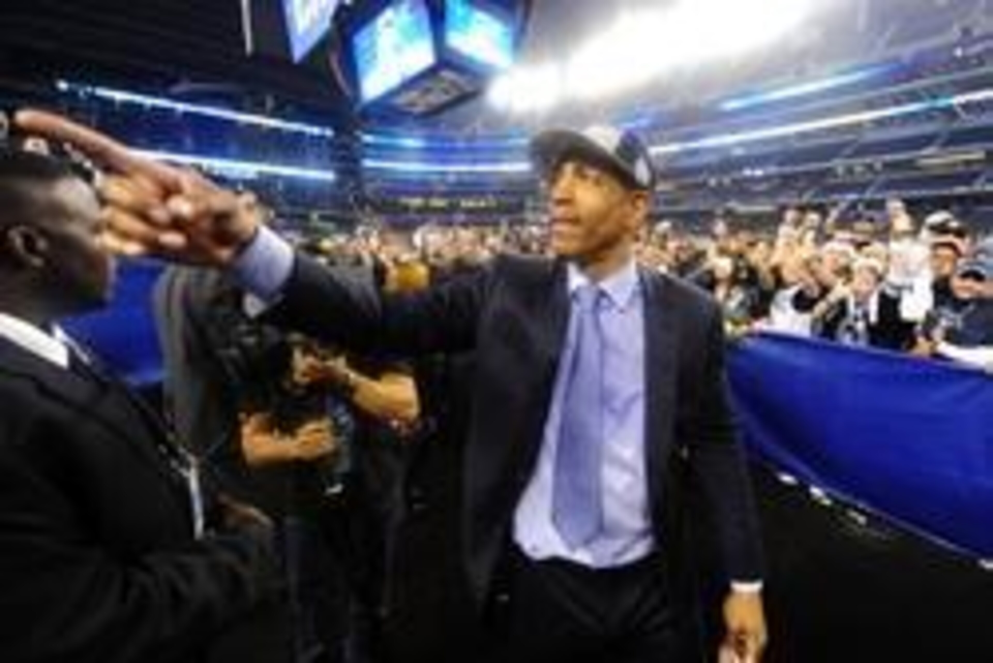 Apr 7, 2014; Arlington, TX, USA; Connecticut Huskies head coach Kevin Ollie gestures to fans after defeating the Kentucky Wildcats in the championship game of the Final Four in the 2014 NCAA Mens Division I Championship tournament at AT&T Stadium. Mandato