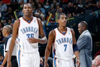 OKLAHOMA CITY, OK - NOVEMBER 01:  (L-R) Kevin Durant #35 and Kevin Ollie #7 of the Oklahoma City Thunder take a break from the action during the game against the Portland Trail Blazers on November 1, 2009 at the Ford Center in Oklahoma City, Oklahoma.  Th