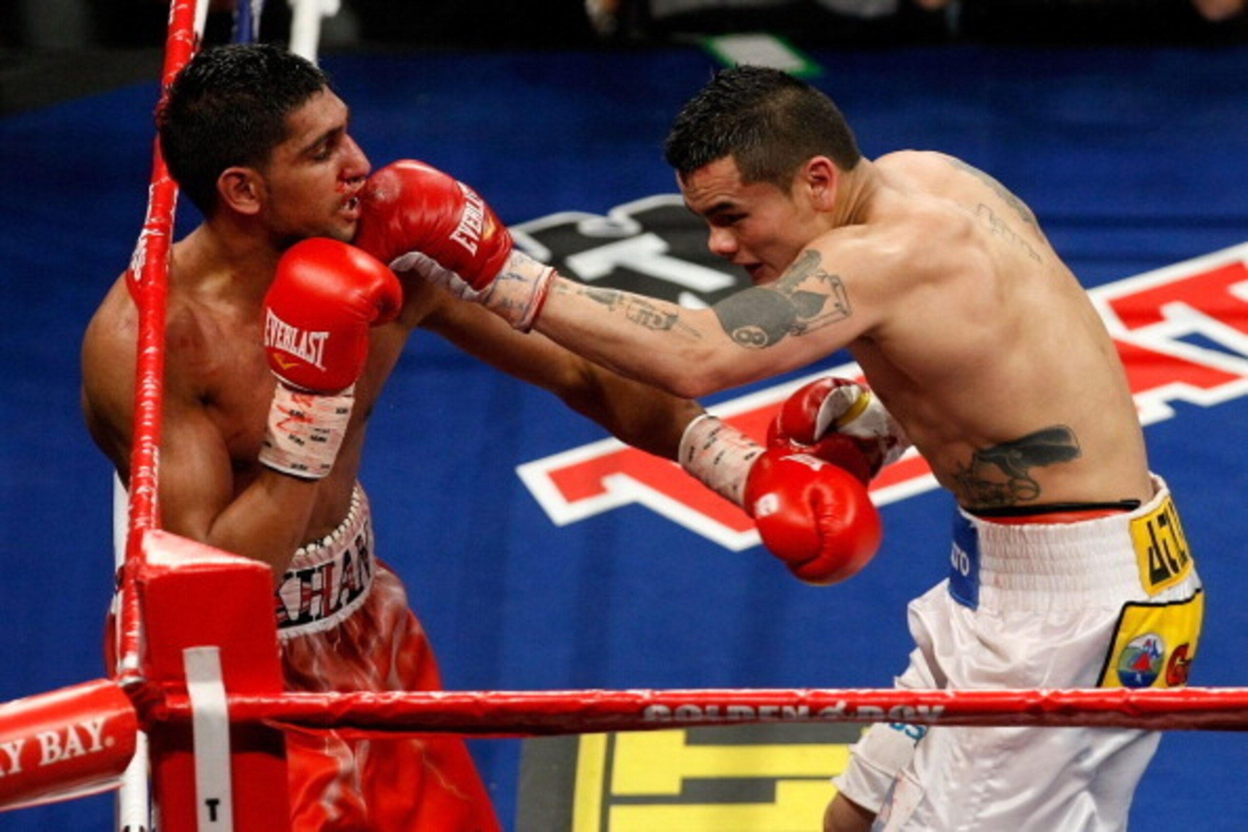 LAS VEGAS - DECEMBER 11:  (R-L) Marcos Maidana of Argentina connects with a left at Amir Khan of England during the WBA super lightweight title fight at Mandalay Bay Events Center on December 11, 2010 in Las Vegas, Nevada.  (Photo by Ethan Miller/Getty Im