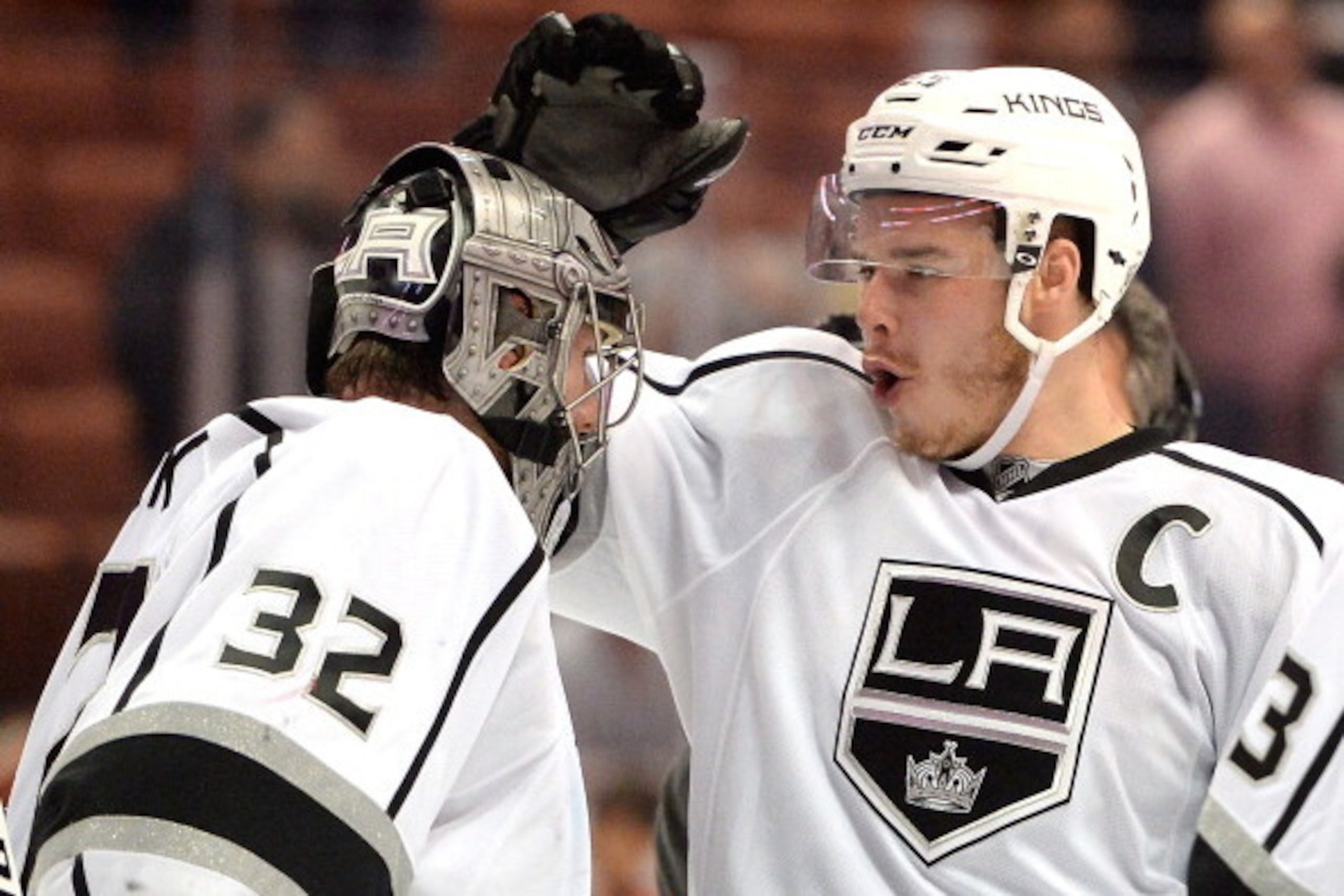 ANAHEIM, CA - MAY 05:  Dustin Brown #23 of the Los Angeles Kings celebrates a 3-1 win with Jonathan Quick #32 over the Anaheim Ducks in Game Two of the Second Round of the 2014 NHL Stanley Cup Playoffs at Honda Center on May 5, 2014 in Anaheim, California
