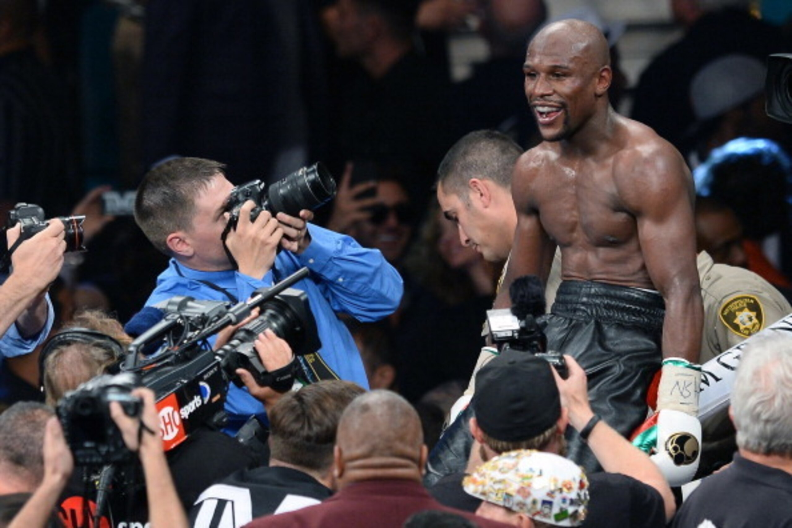 LAS VEGAS, NV - MAY 03:  Floyd Mayweather Jr. celebrates after defeating Marcos Maidana by majority decision in their WBC/WBA welterweight unification fight at the MGM Grand Garden Arena on May 3, 2014 in Las Vegas, Nevada.  (Photo by Ethan Miller/Getty I