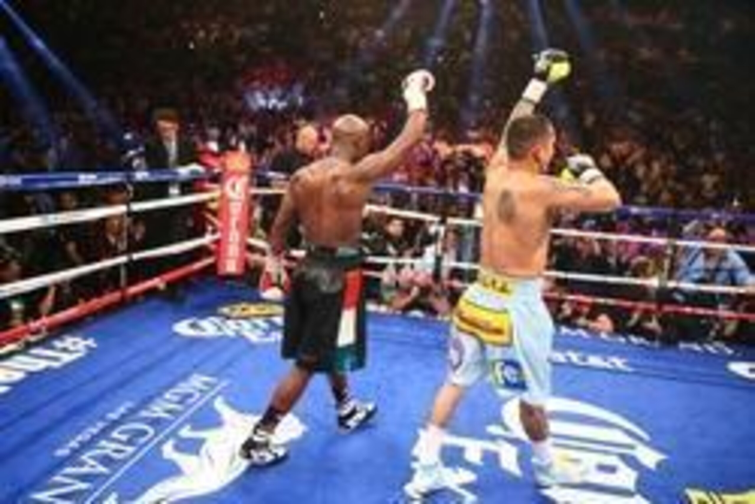 May 3, 2014; Las Vegas, NV, USA; Floyd Mayweather Jr. (black trunks) and Marcos Maidana both react following their fight at MGM Grand. Mandatory Credit: Mark J. Rebilas-USA TODAY Sports