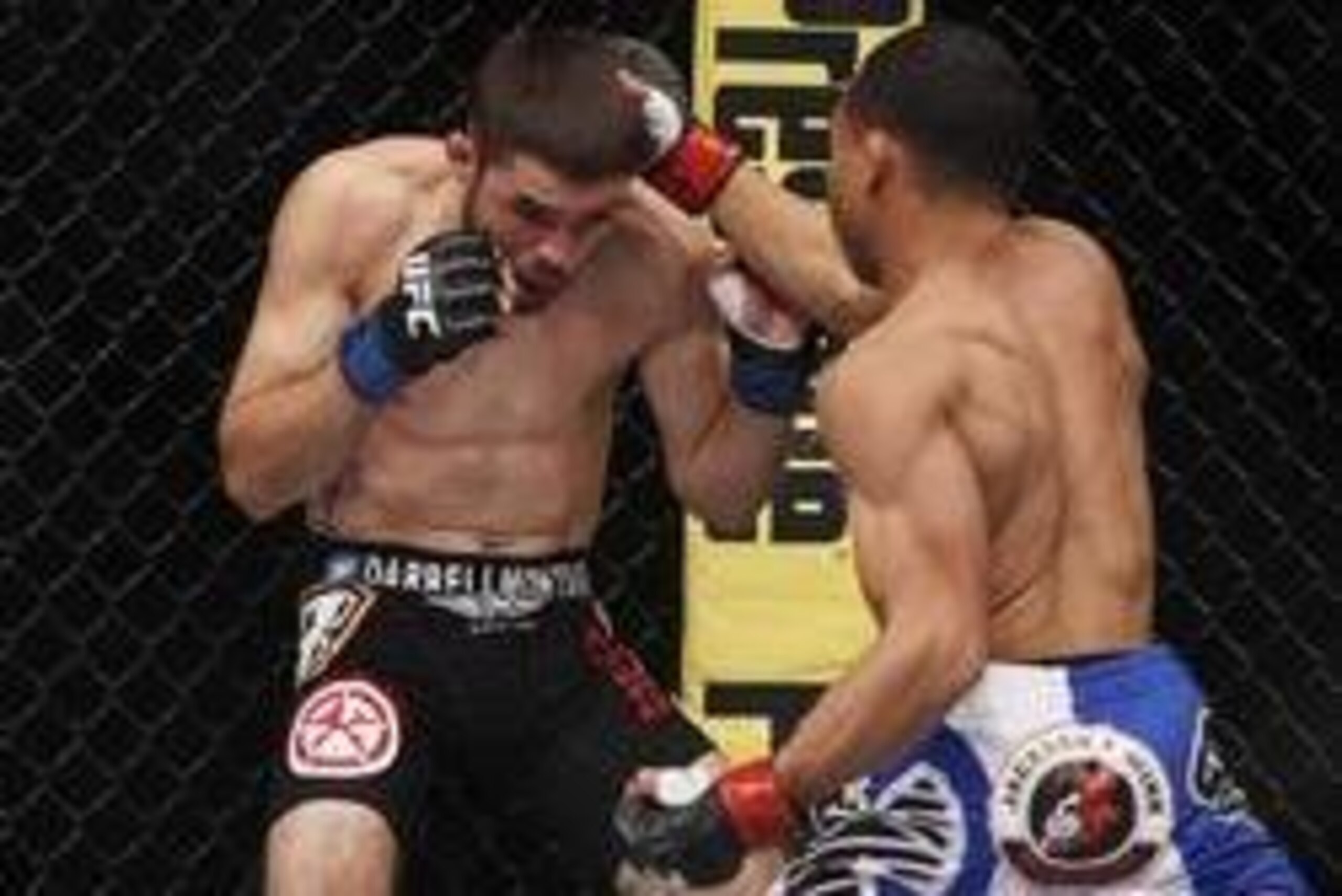 Oct 19, 2013; Houston, TX, USA; John Dodson (red gloves) fights against Darrell Montague (blue gloves) in their flyweight bout during UFC 166 at Toyota Center. Mandatory Credit: Andrew Richardson-USA TODAY Sports